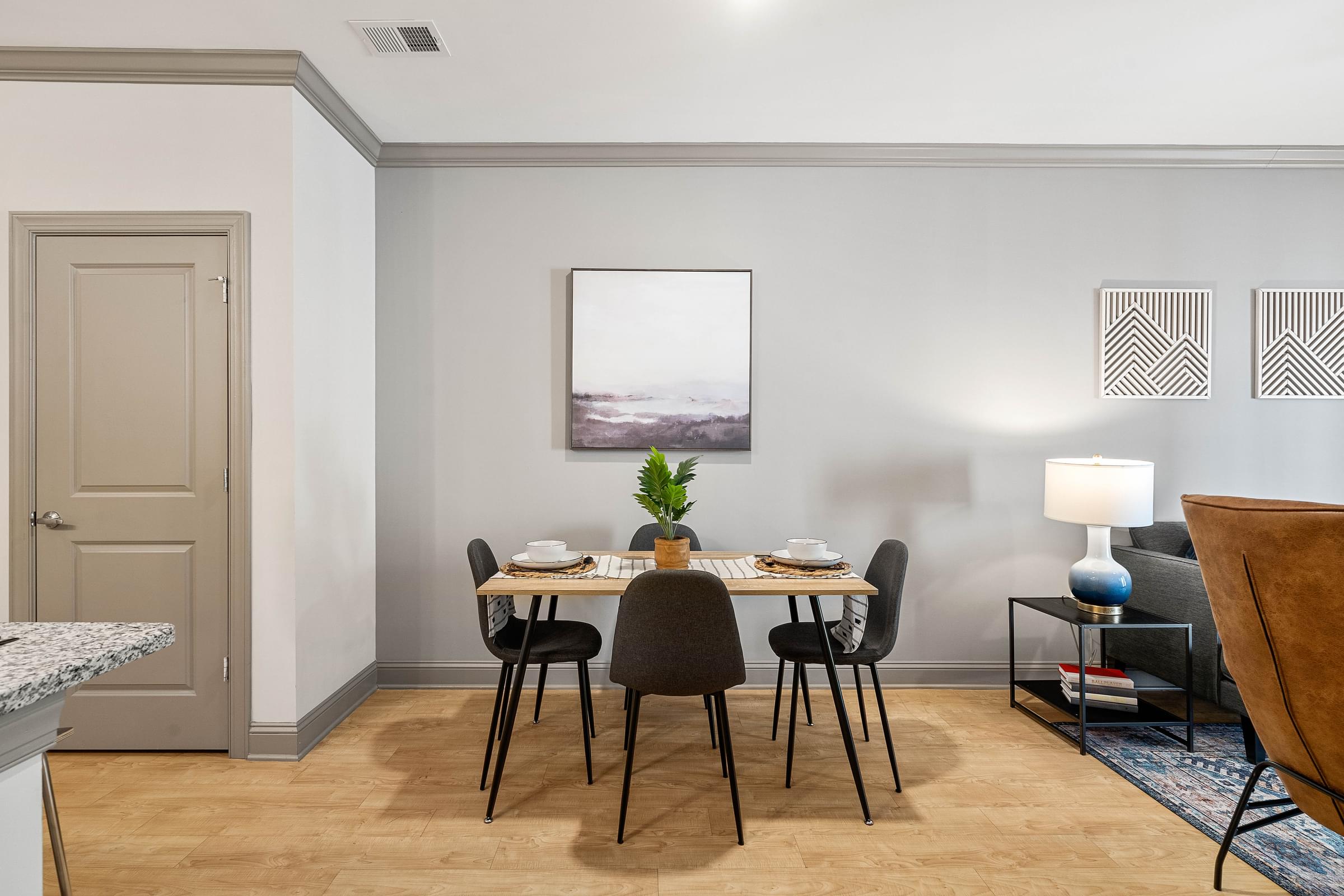 a dining room with a table and chairs