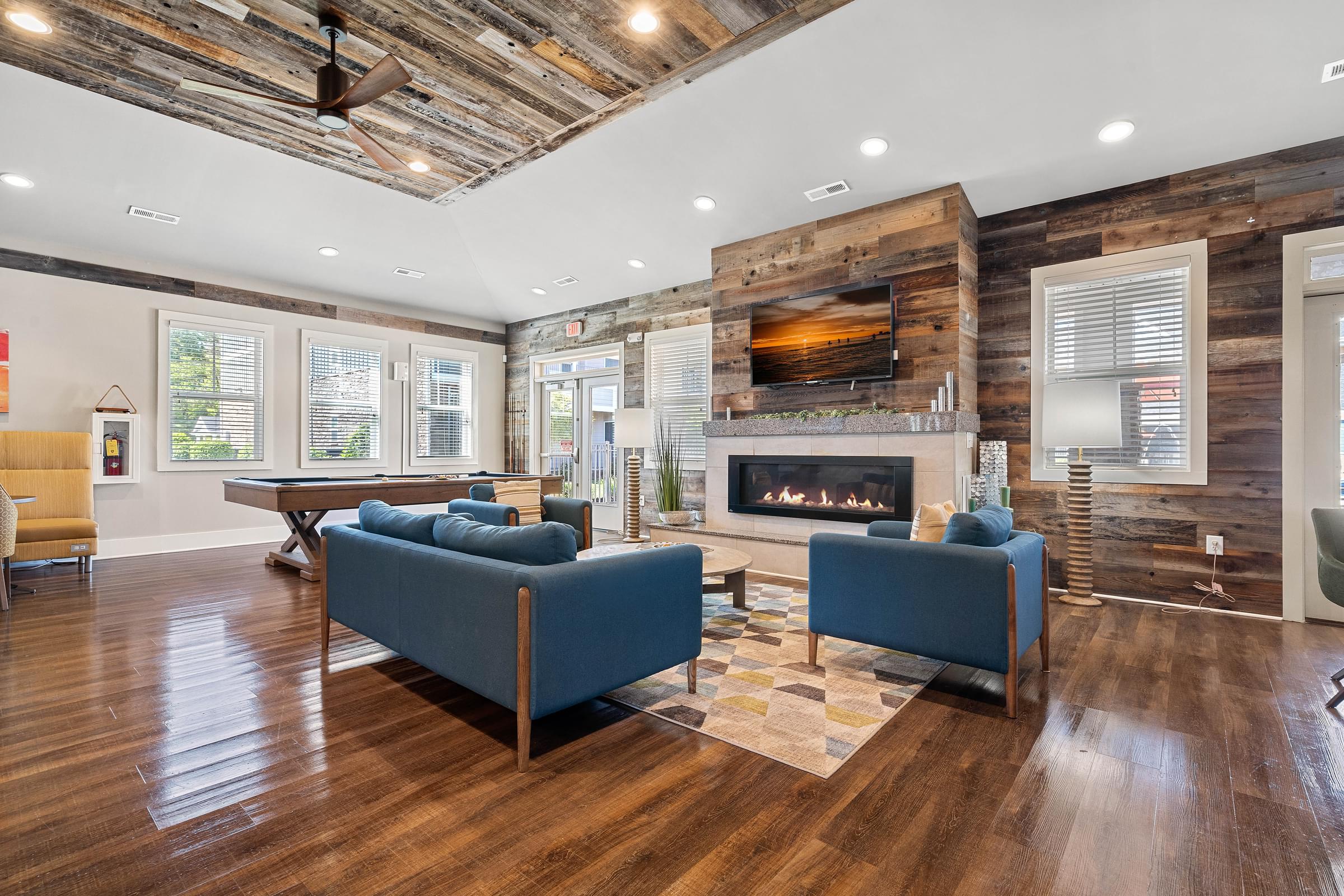 a living room with couches and a fireplace