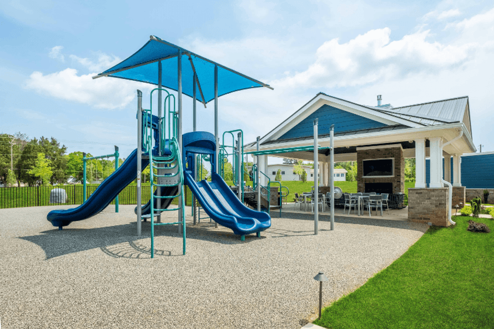 a playground with slides and a pavilion