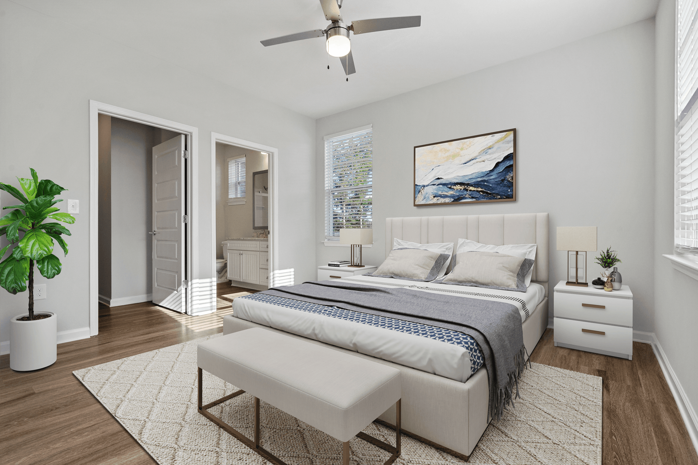 a white bedroom with a bed and a ceiling fan
