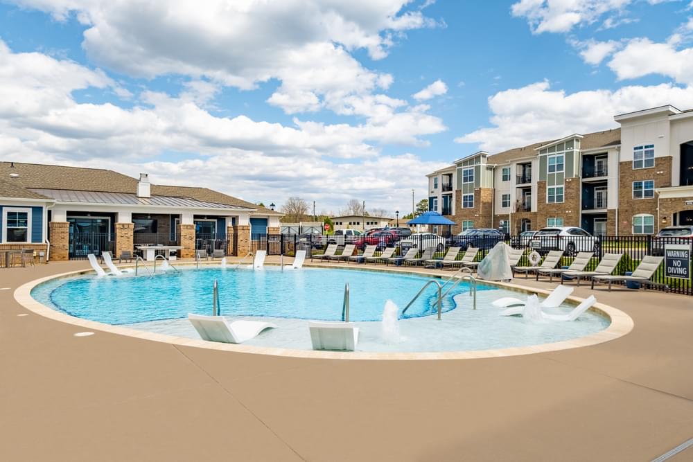the preserve at ballantyne commons community swimming pool with apartment buildings