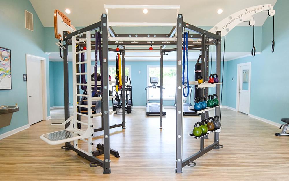 a gym with weights and equipment in a home