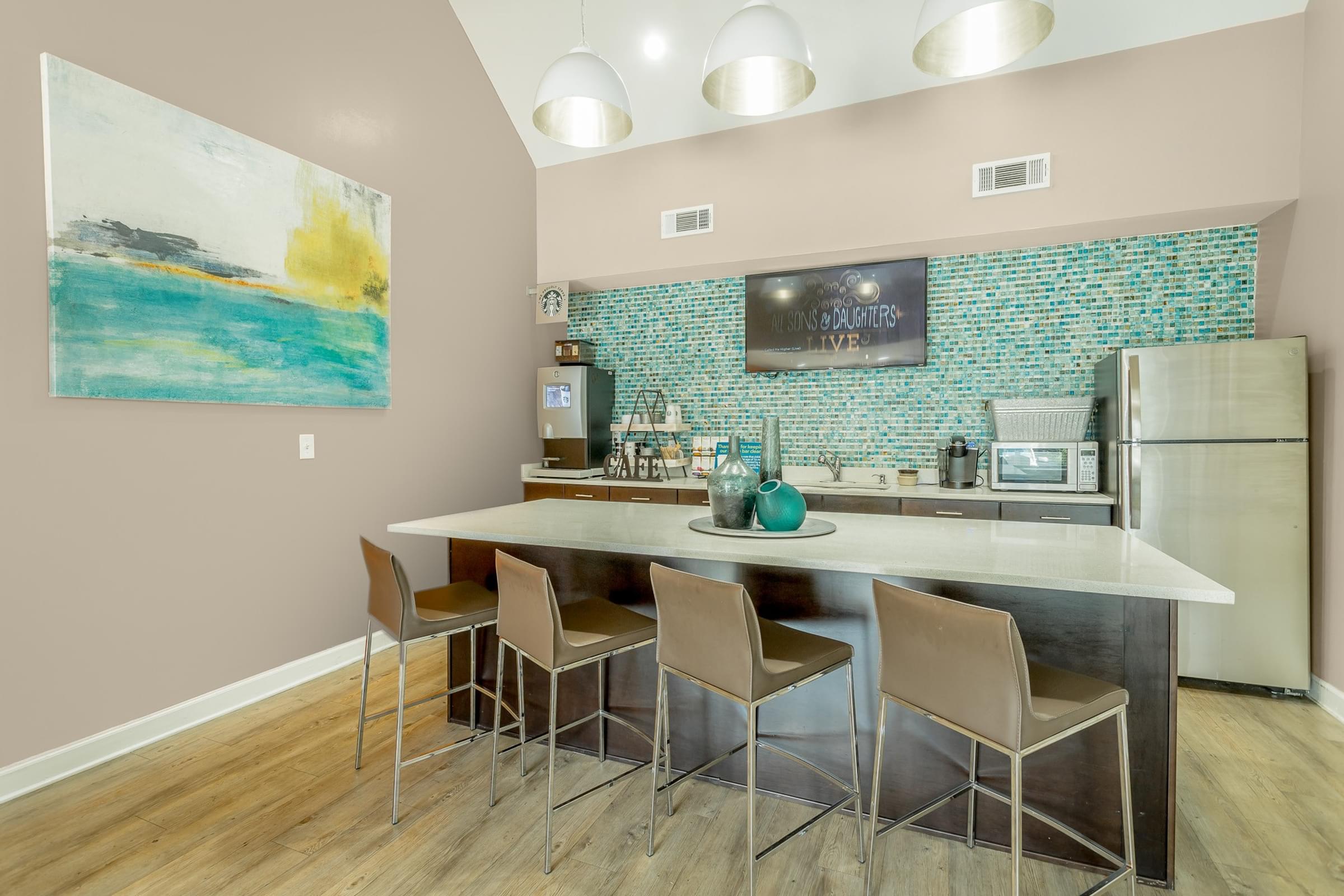 Community Clubhouse with Large Kitchen Island and Stainless Steel Appliances