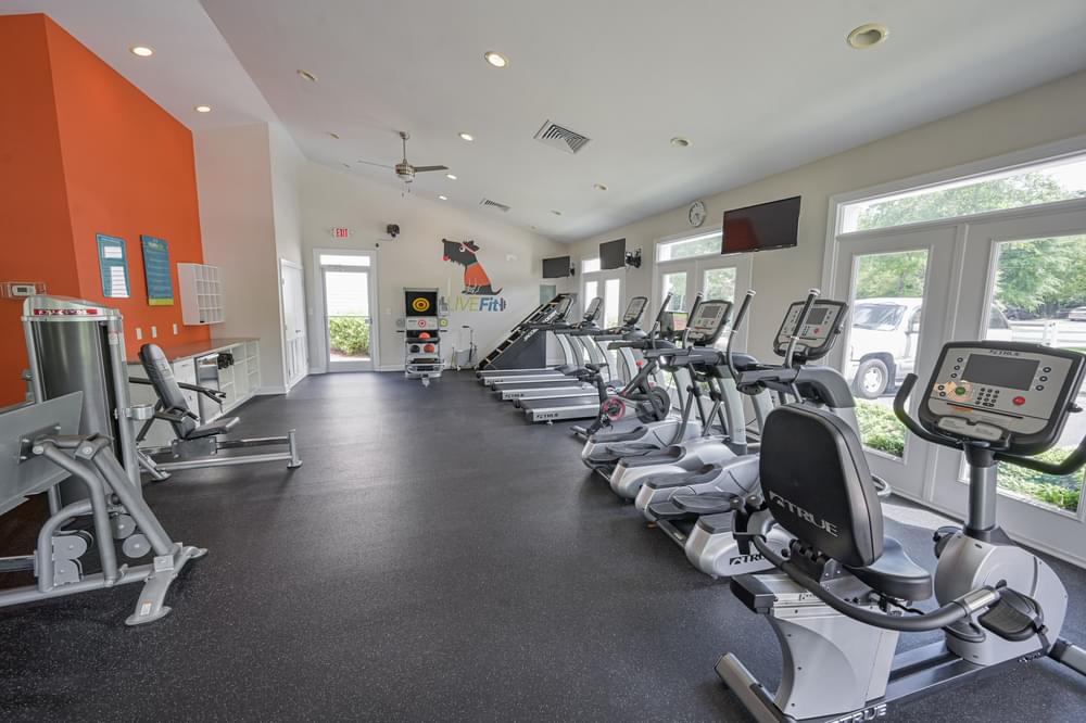 the gym at the village on spring mill apartments wi