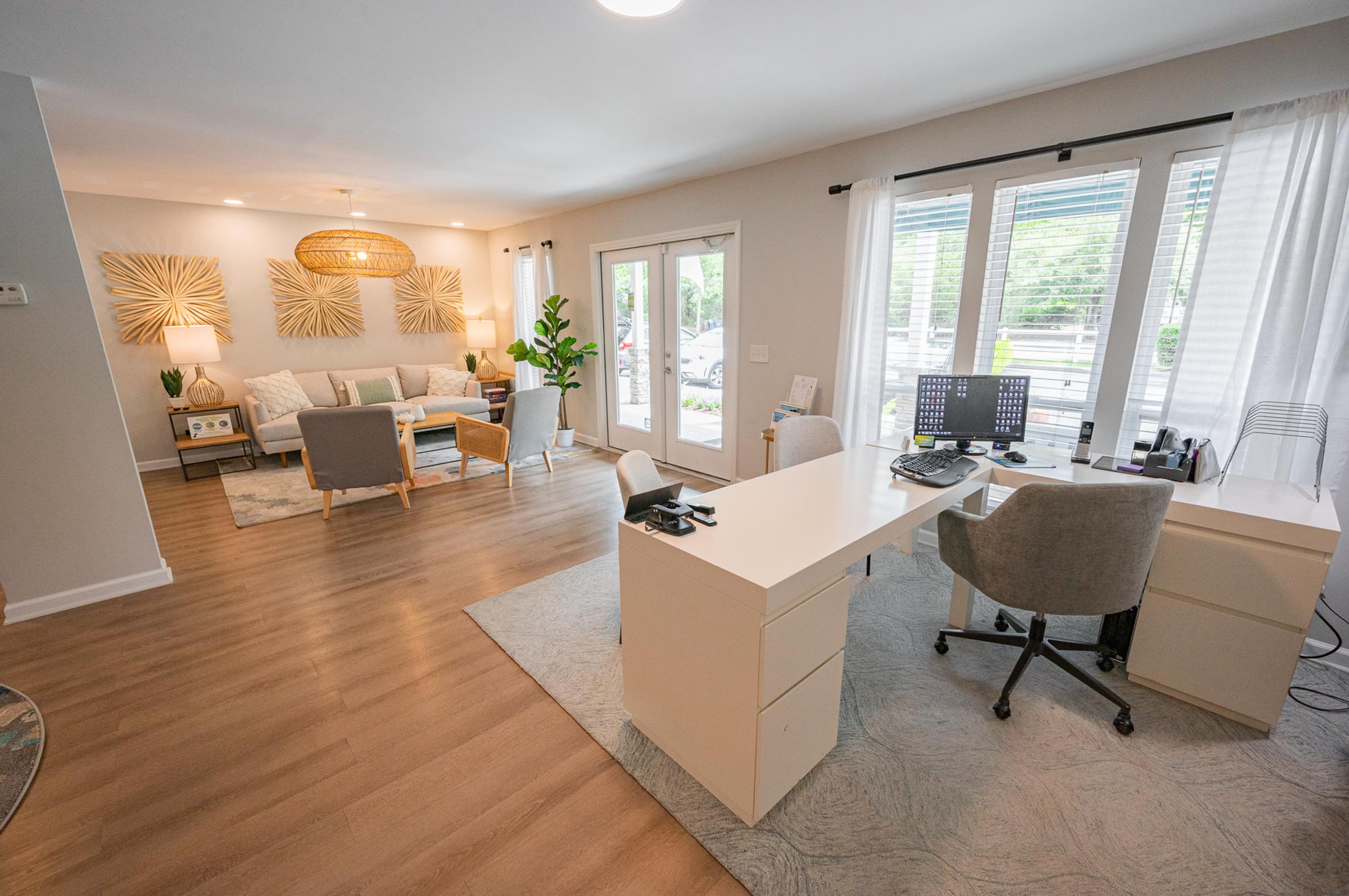 the living room of a home with a desk and a couch