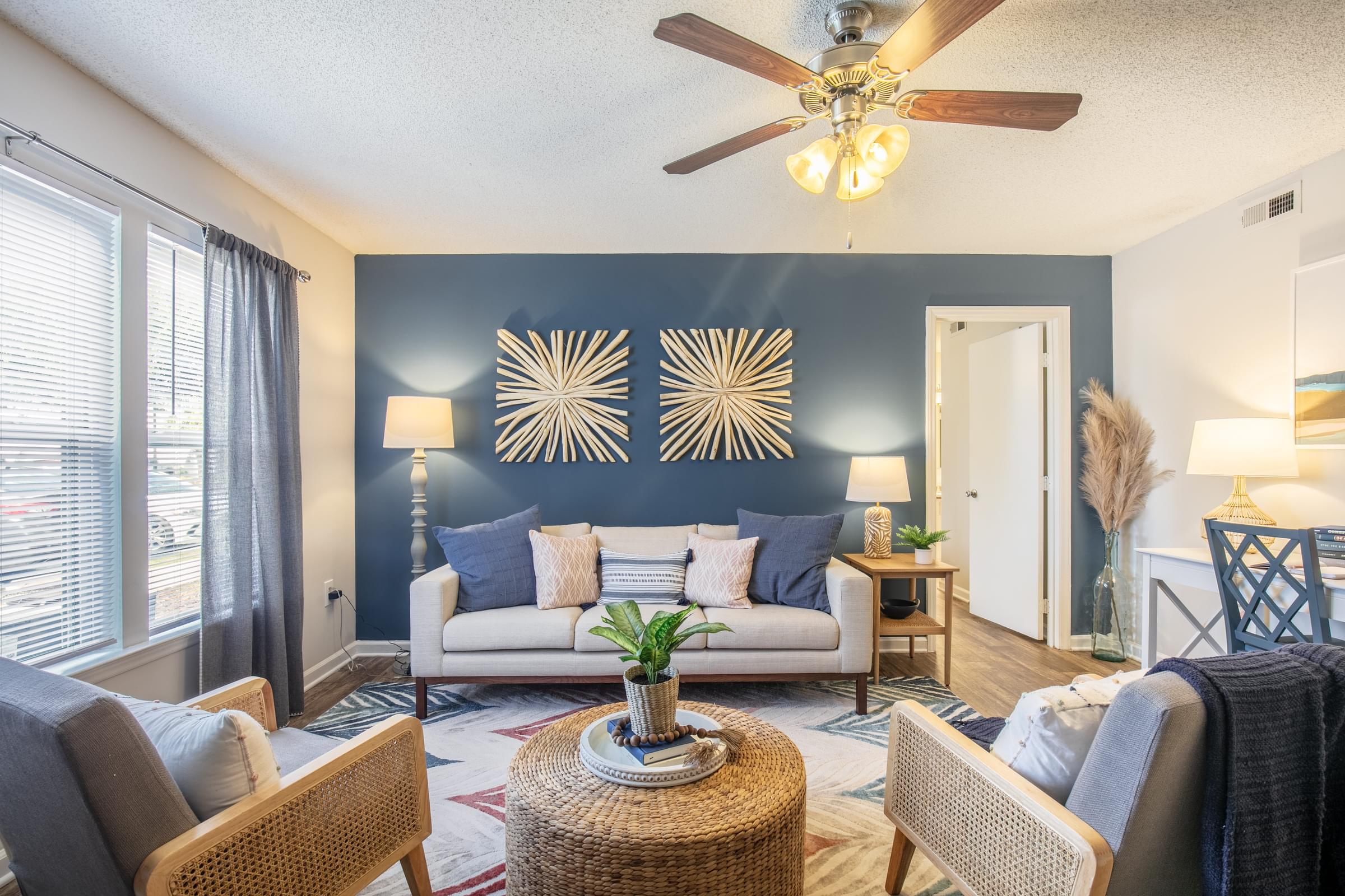 Living Room with Wood Vinyl Flooring and Ceiling Fan with Lights
