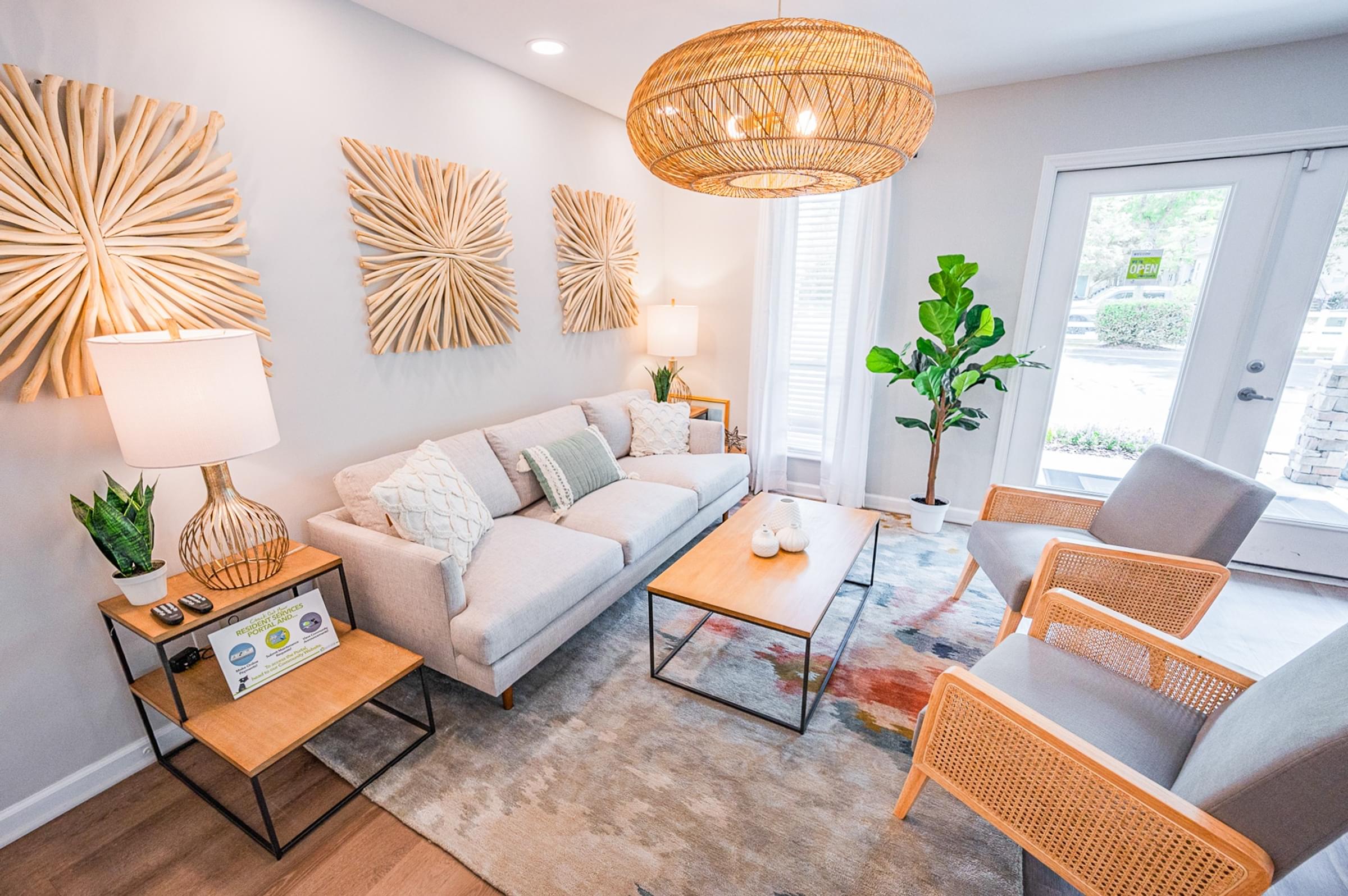 a living room with couches and chairs