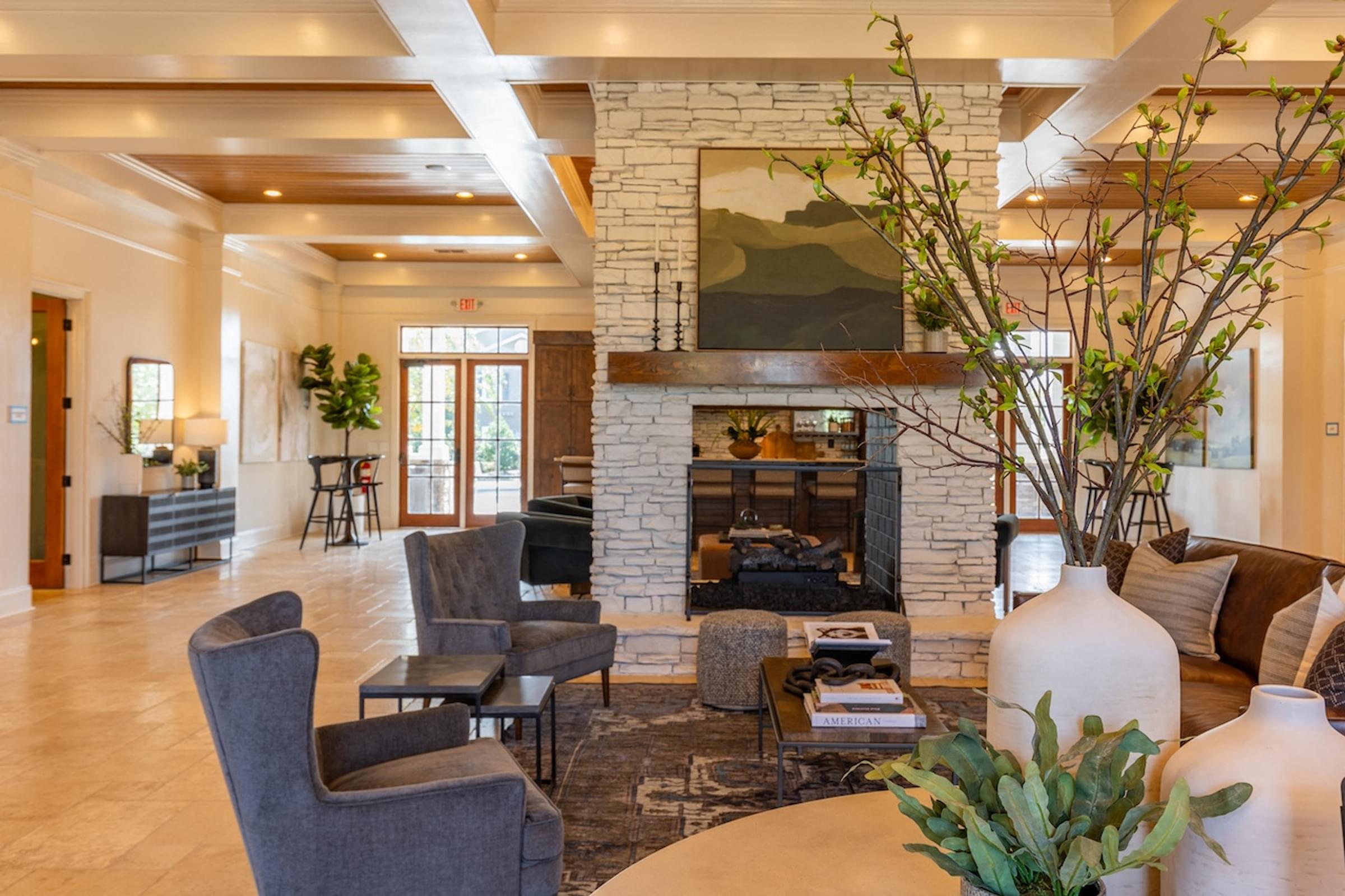 a living room with furniture and a fireplace