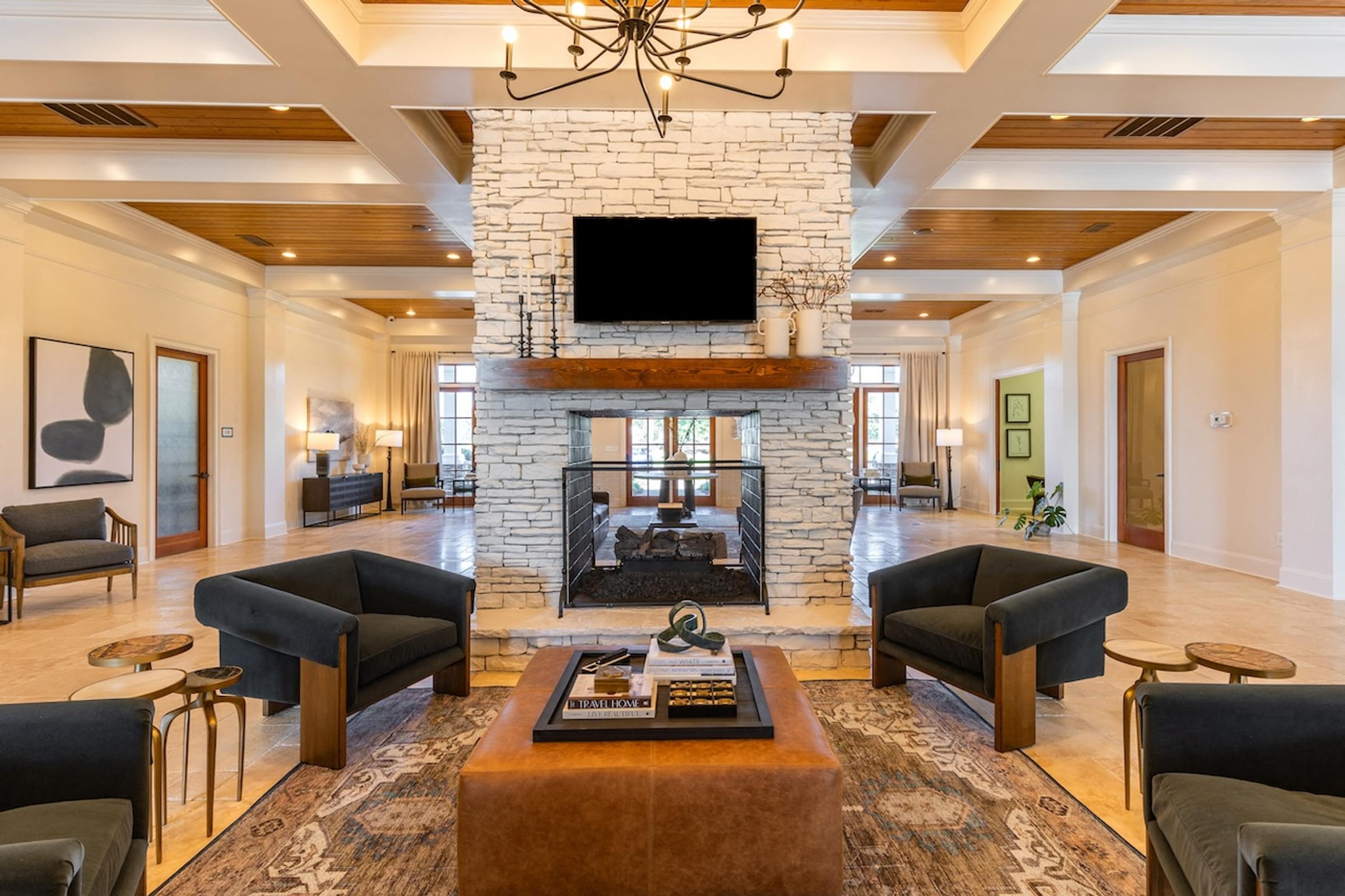 a living room with a fireplace and a tv on top of it