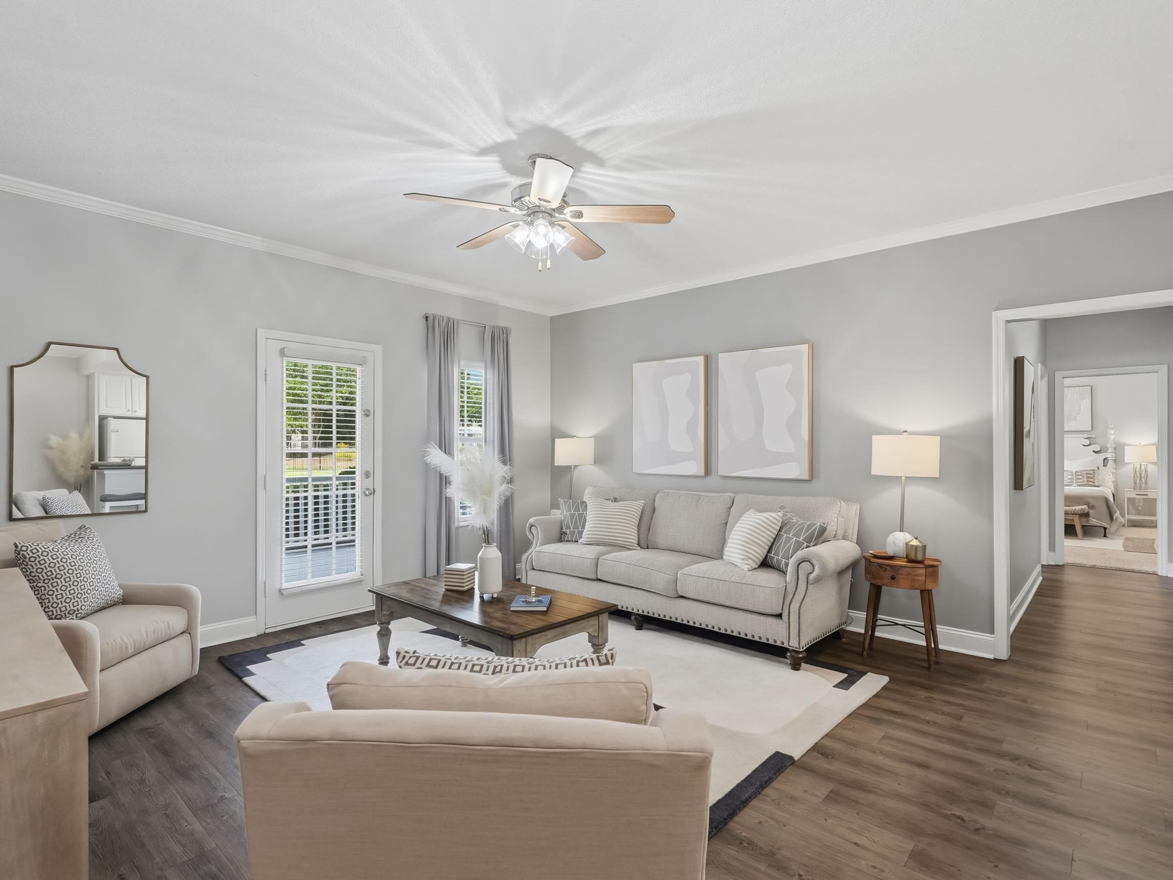 Open-Concept Living Rooms with Ceiling Fans and Large Windows