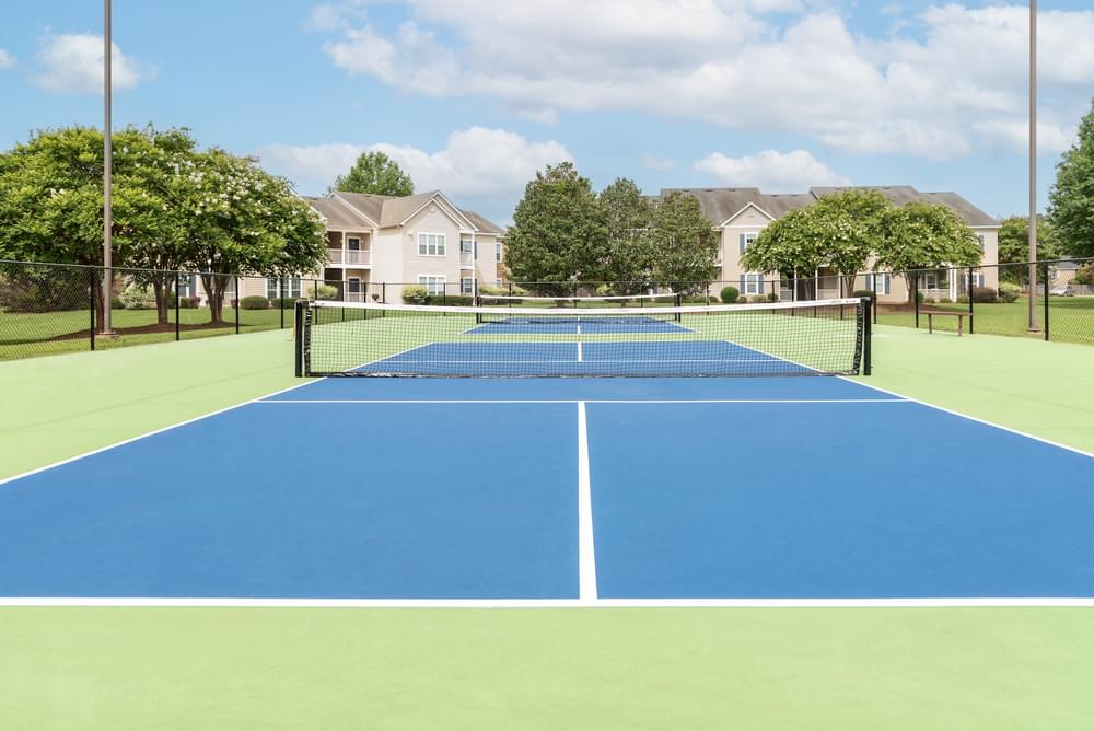 a tennis court with blue and green surfaces and a net