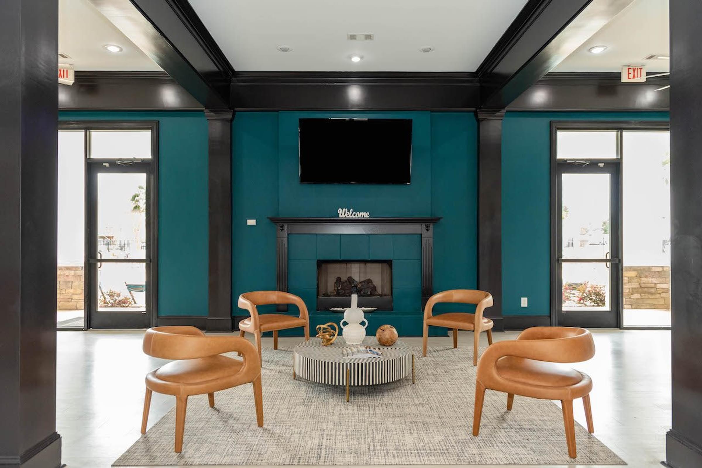 a living room with a fireplace and a television