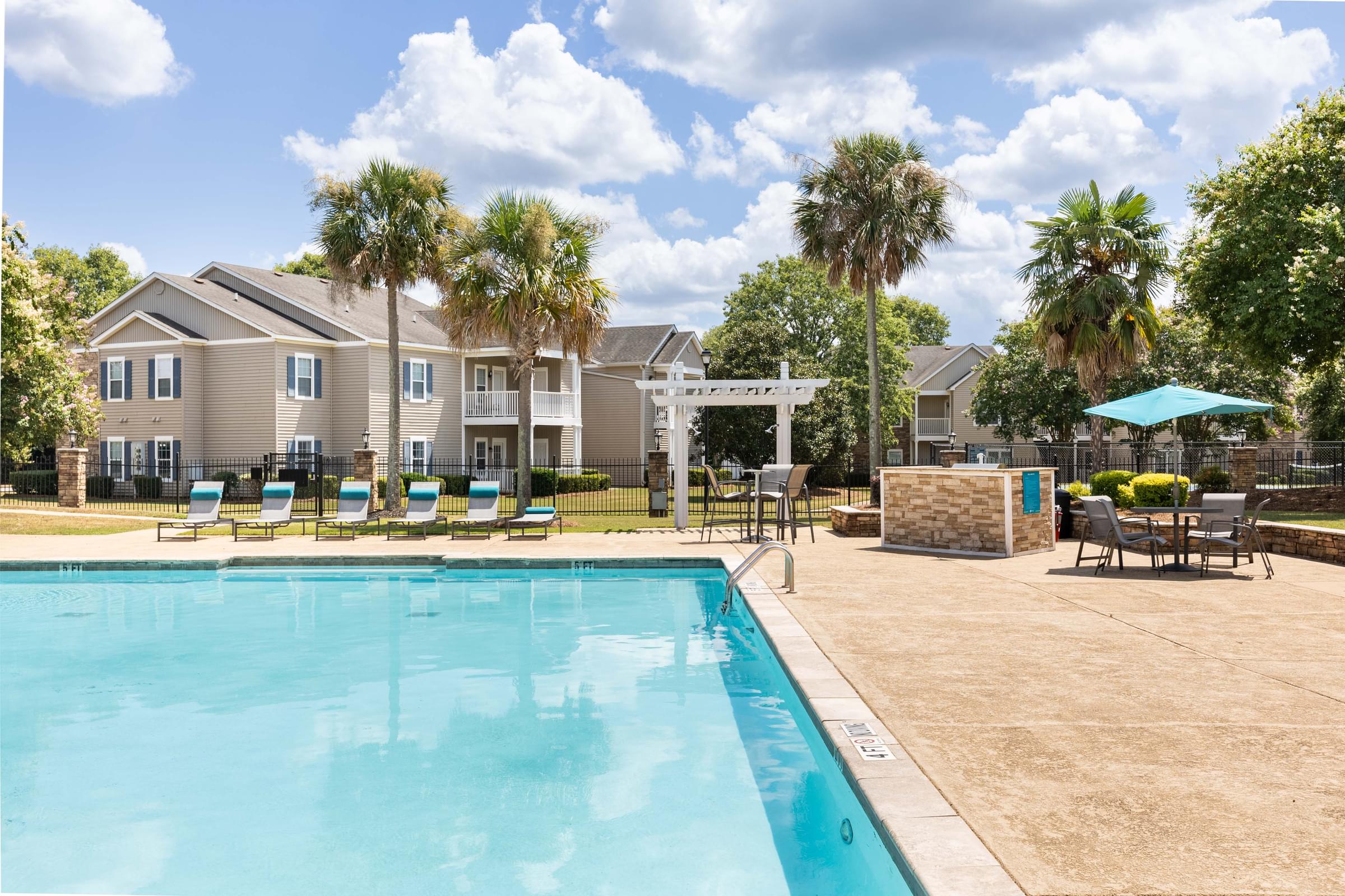 Tranquil Poolside Retreat Surrounded by Palm Trees