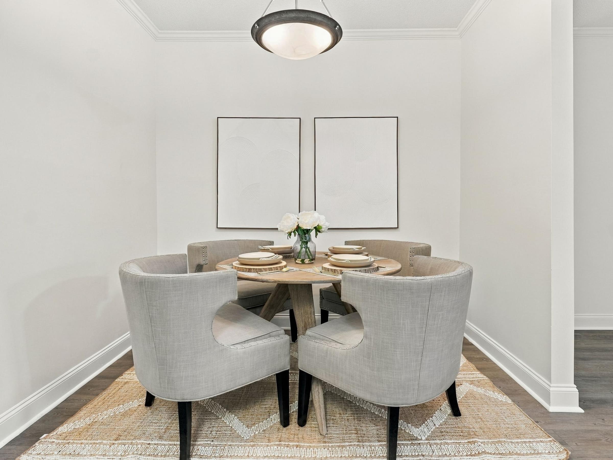 A dining room with a table set for two.