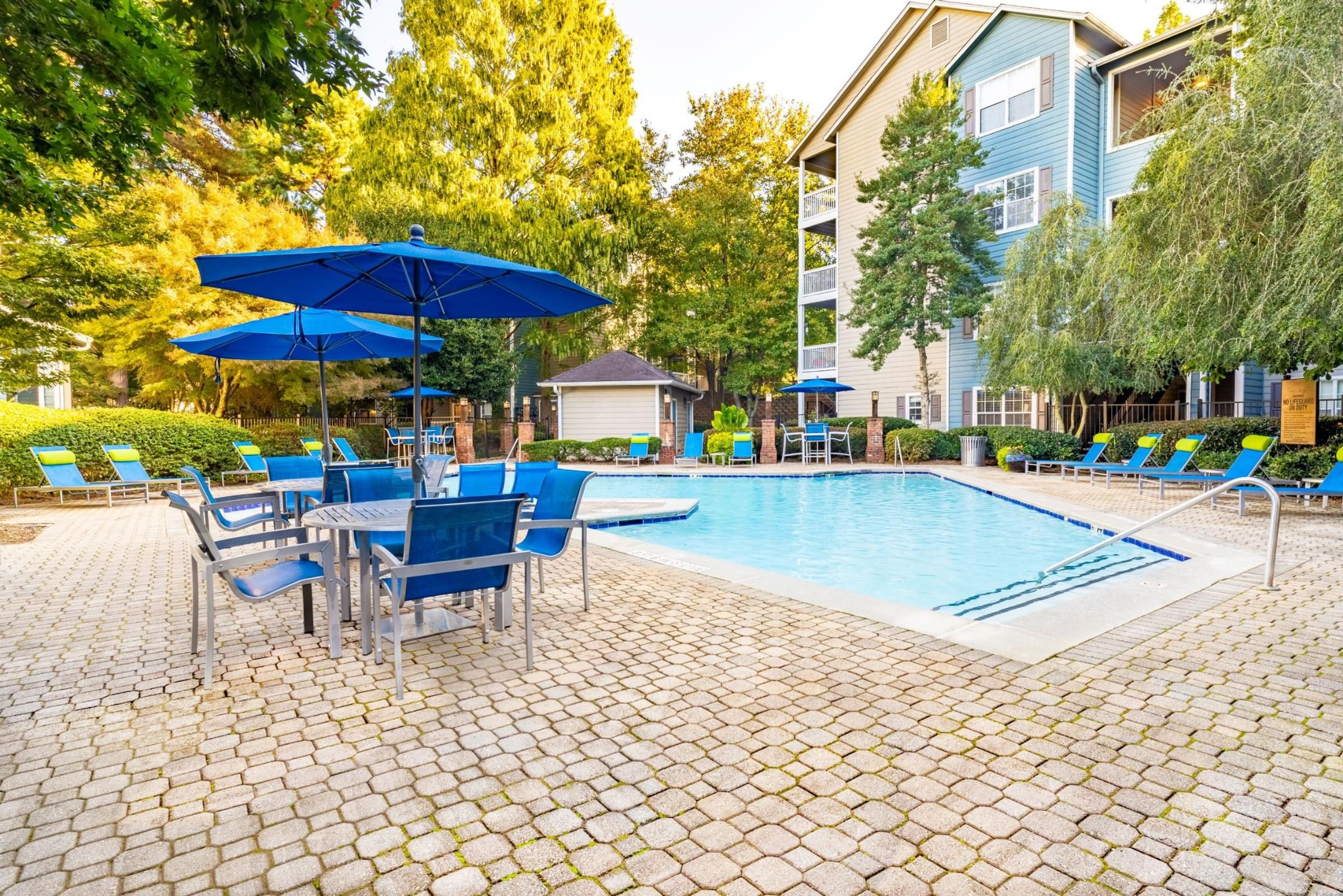 Resort-Style Swimming Pool with Expansive Sundeck and Lounge Seating