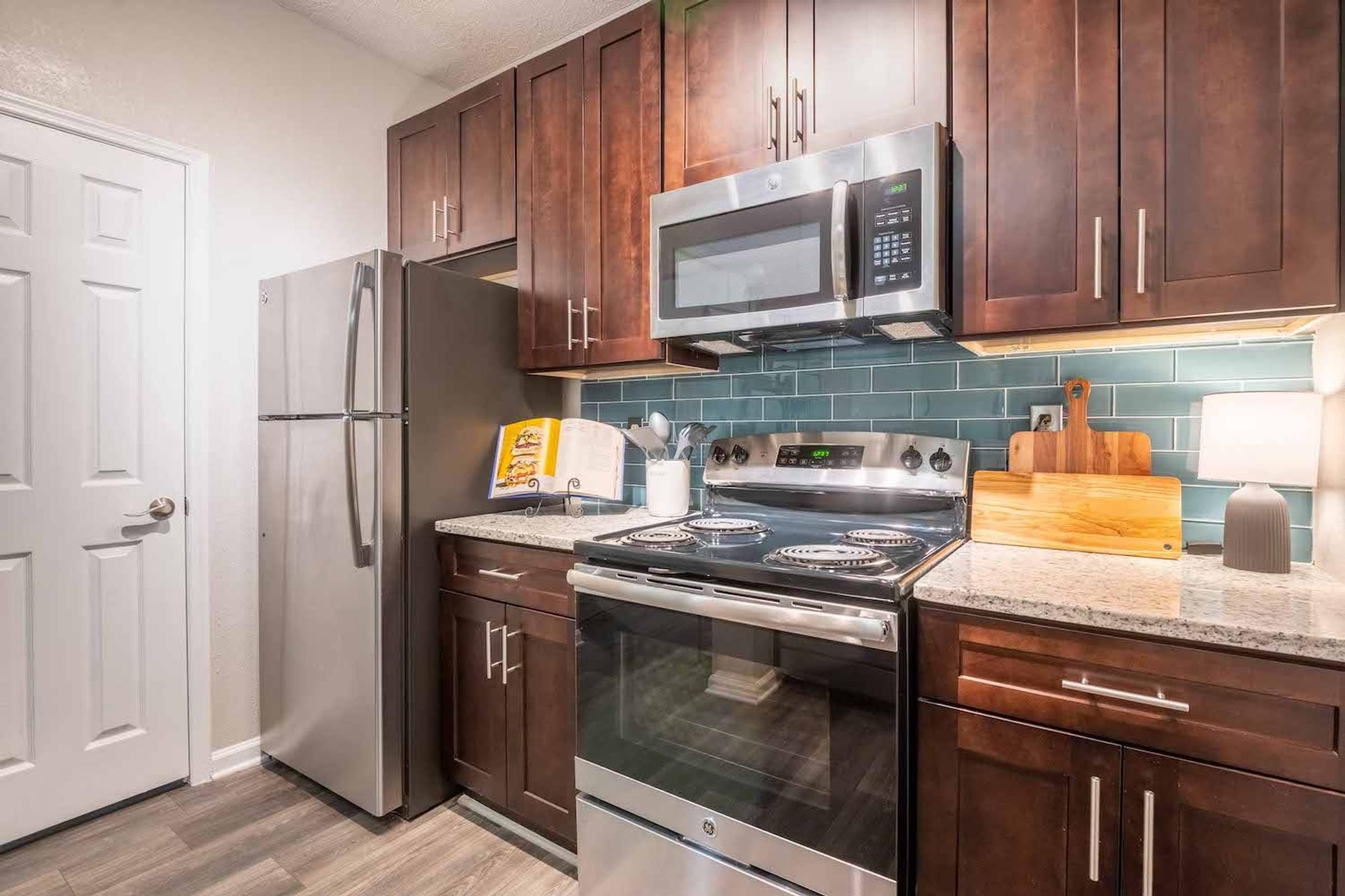 Modern Kitchen Featuring Custom Espresso Cabinetry and Pantry