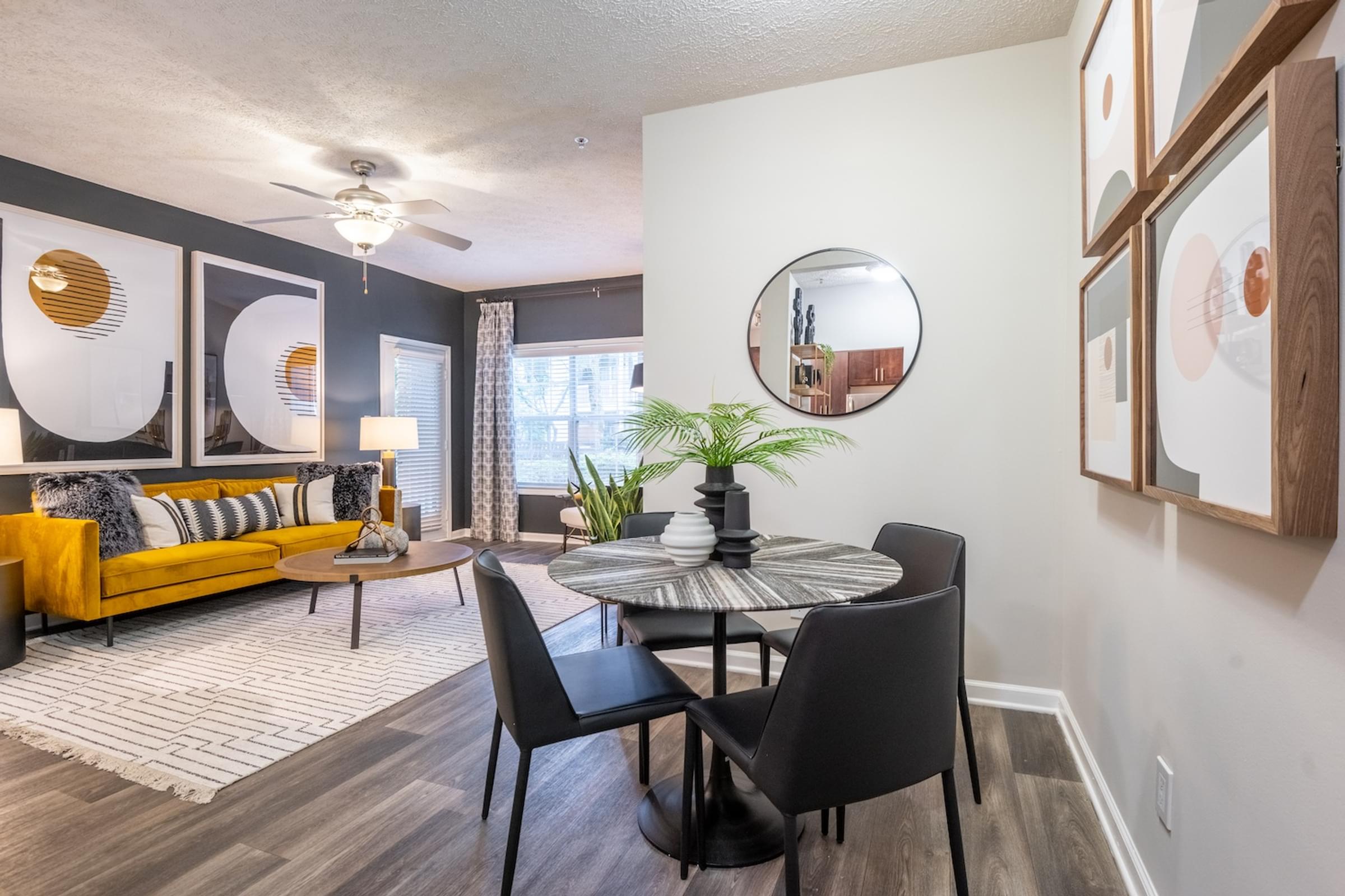 our apartments offer a living room with a dining room table and chairs