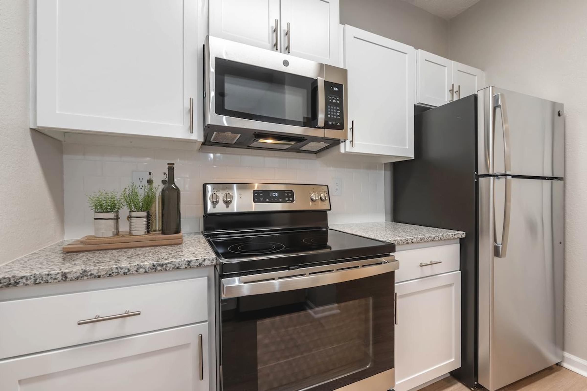 White Cabinets with Stainless Steel Appliances