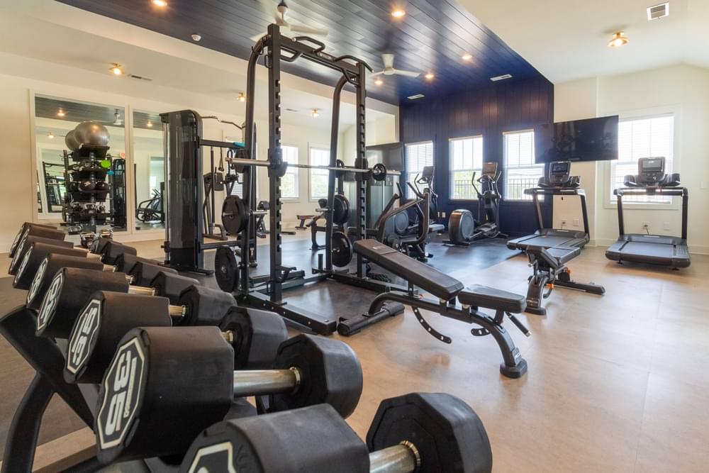 a room filled with weights and other exercise equipment