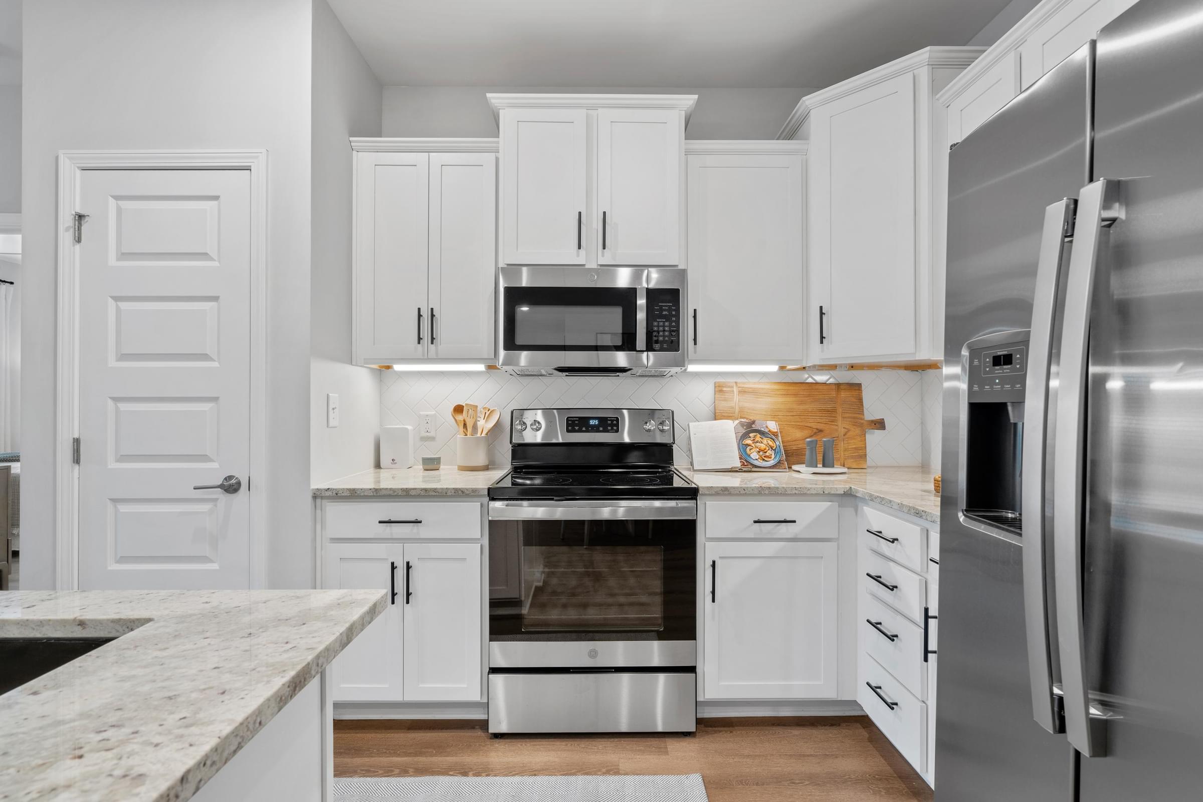 Modern Kitchens with Stand-Alone Islands, Designer Tile Backsplash and Granite Countertops
