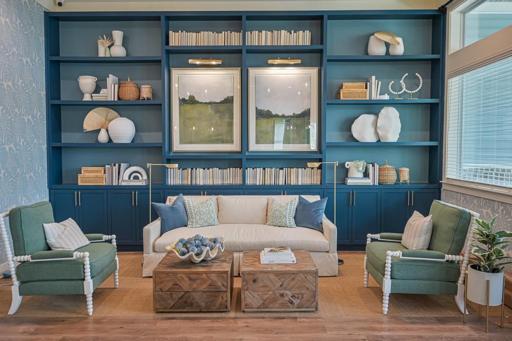 a living room with blue shelving and a white couch