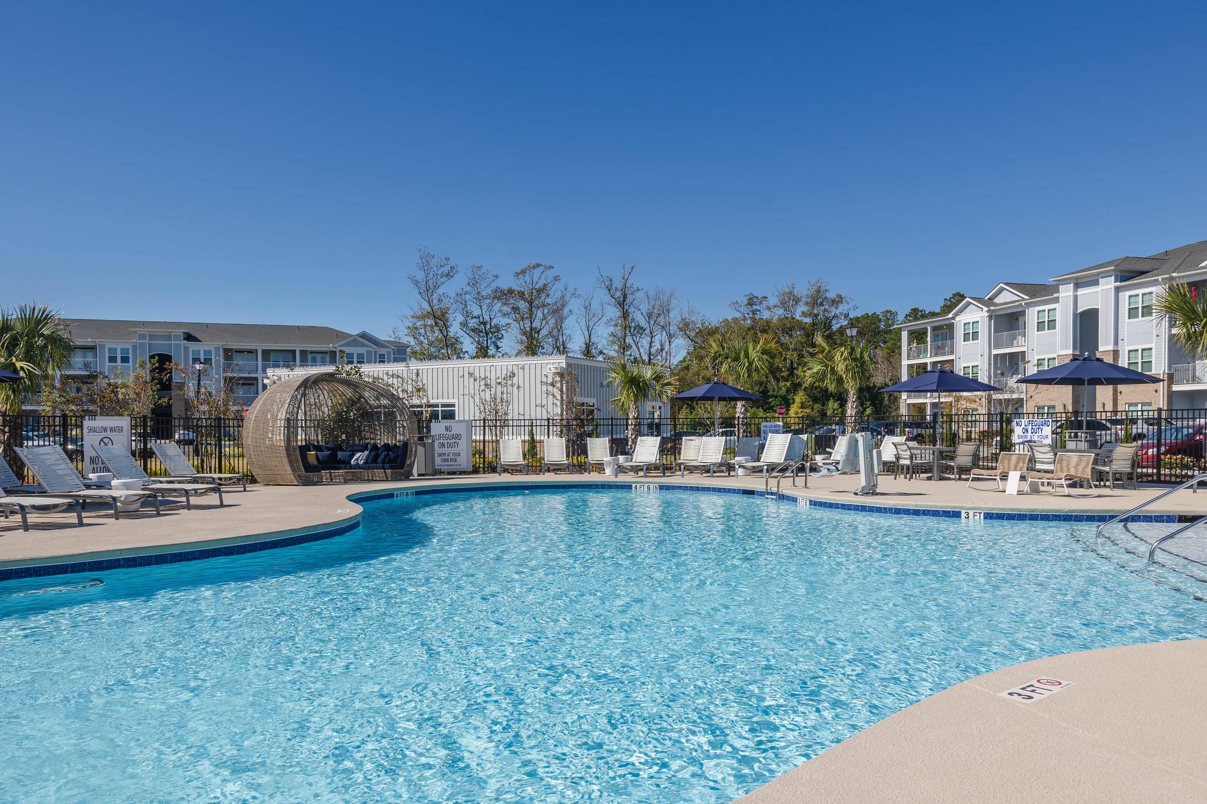 Custom Saltwater Swimming Pool with Sundeck, Poolside Cabanas, and Grills