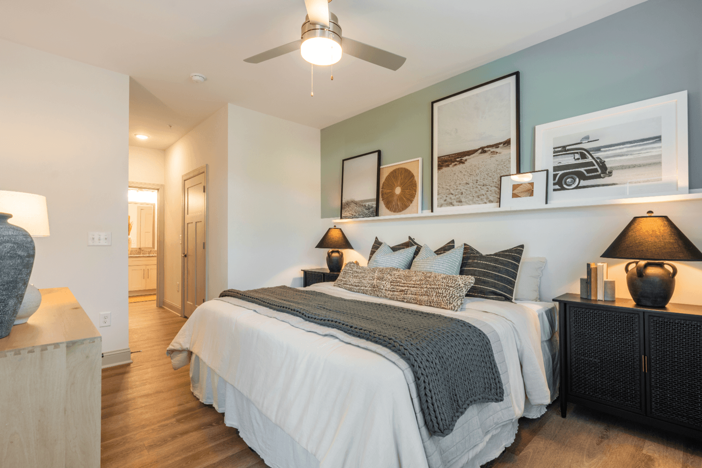 a bedroom with a bed and a ceiling fan