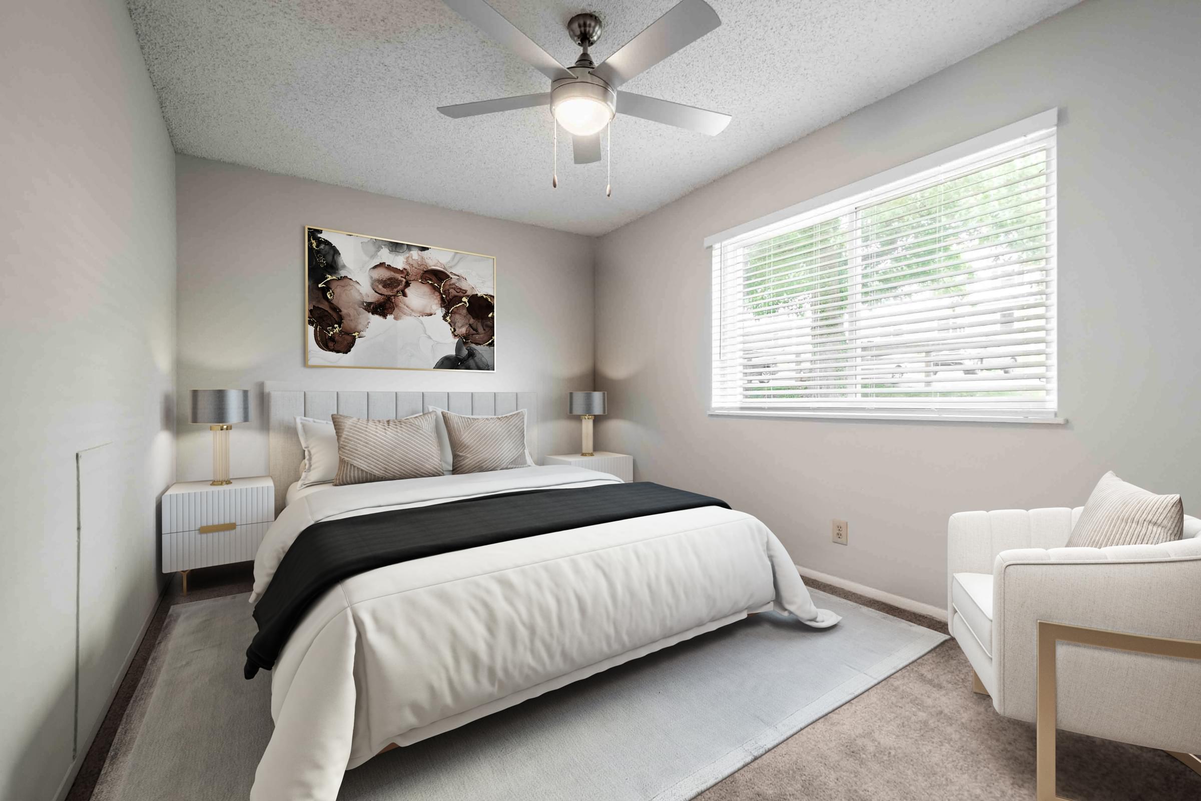 Spacious Bedroom With Ceiling Fan and Plush Carpeting.
