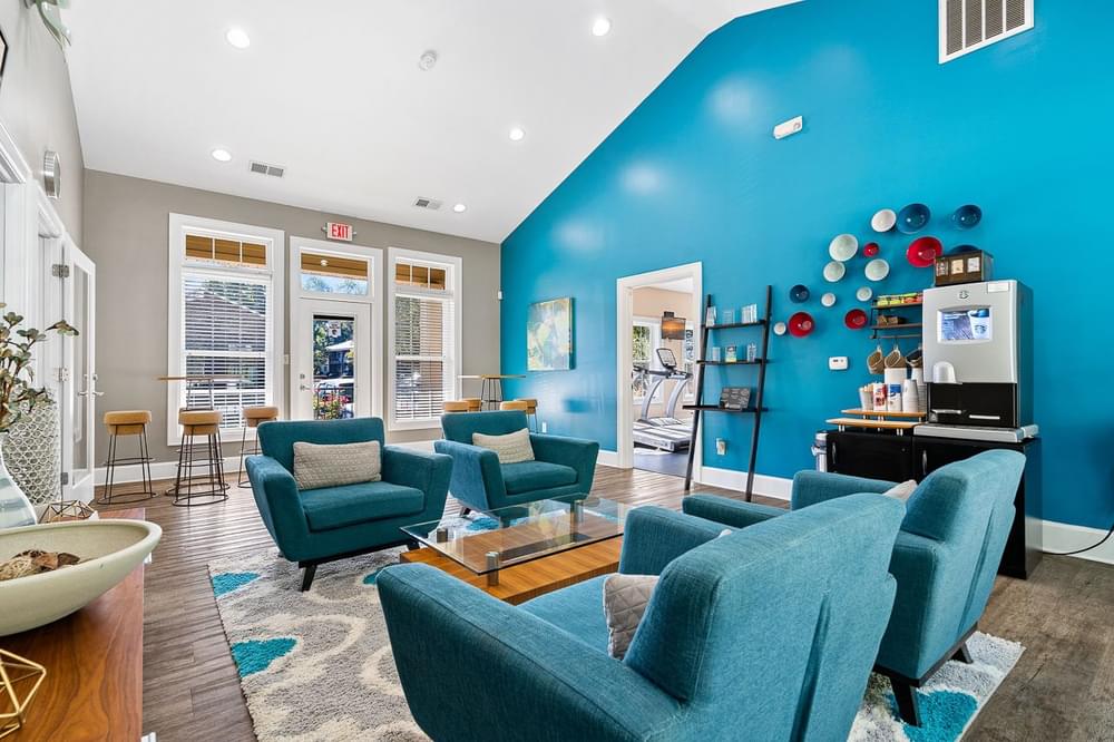 a living room with a blue wall and furniture