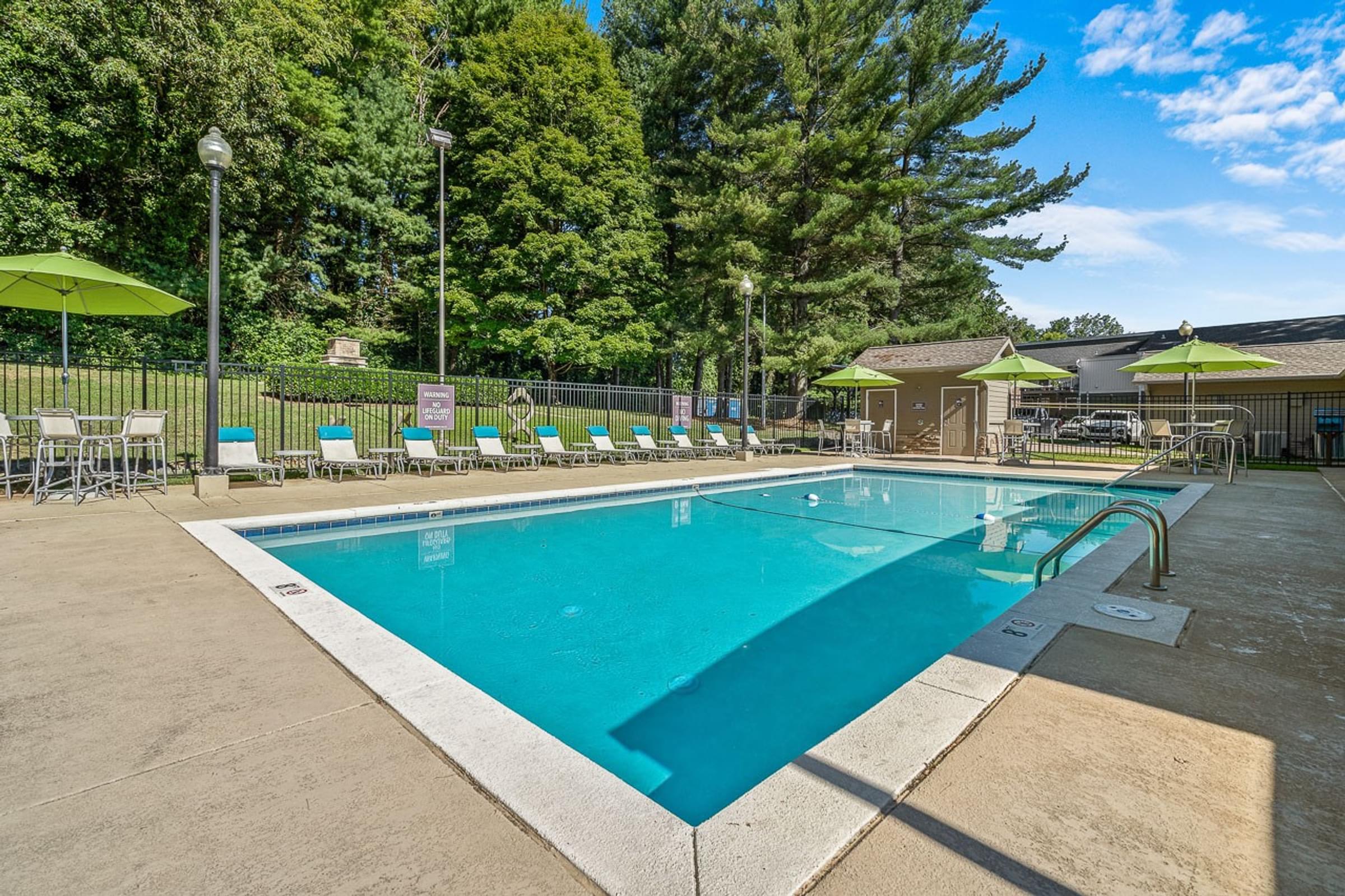 Resort-Style Swimming Pool With Outdoor Kitchen Area