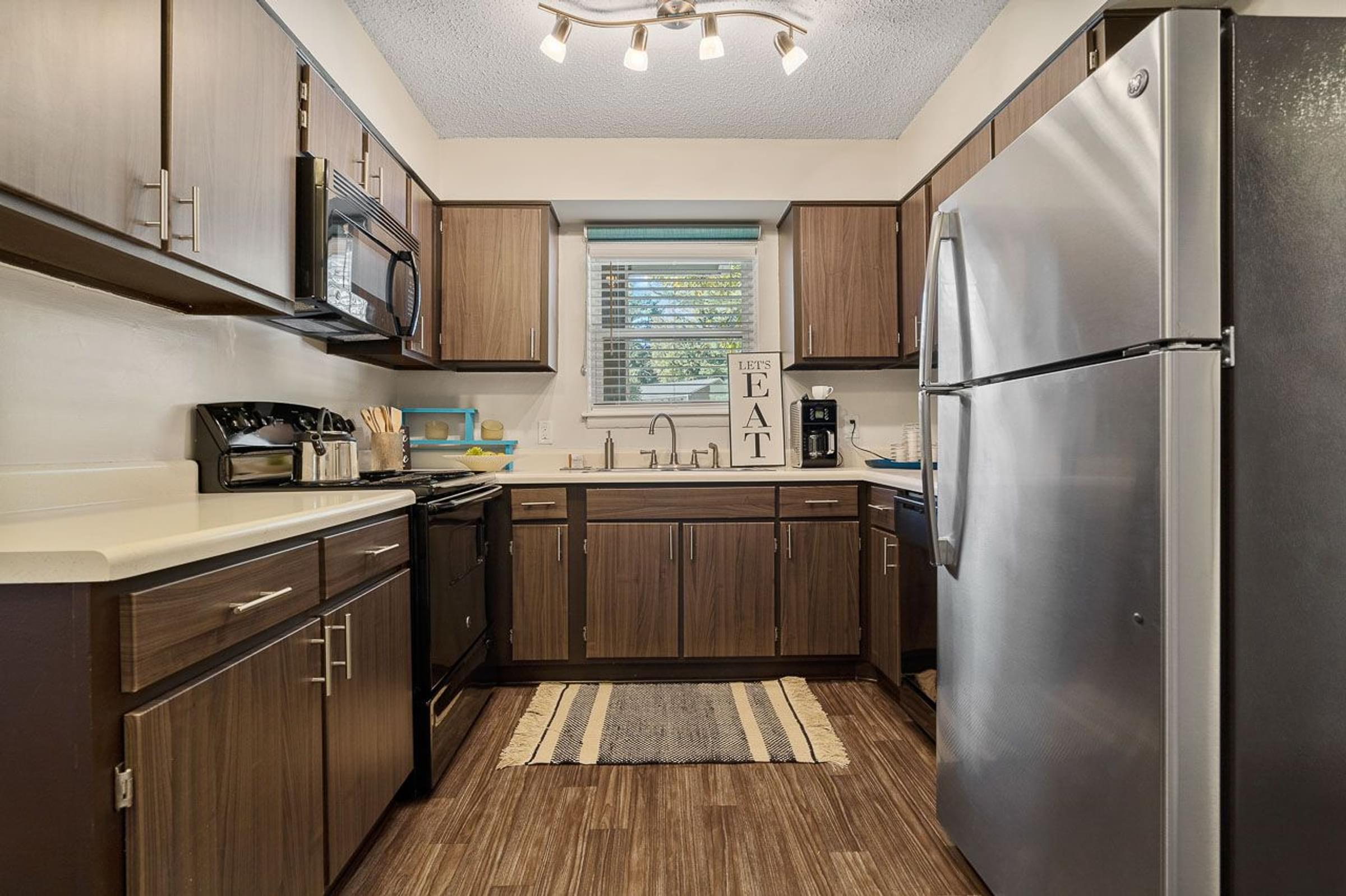 Renovated Cabinets With Stainless Steel Appliances