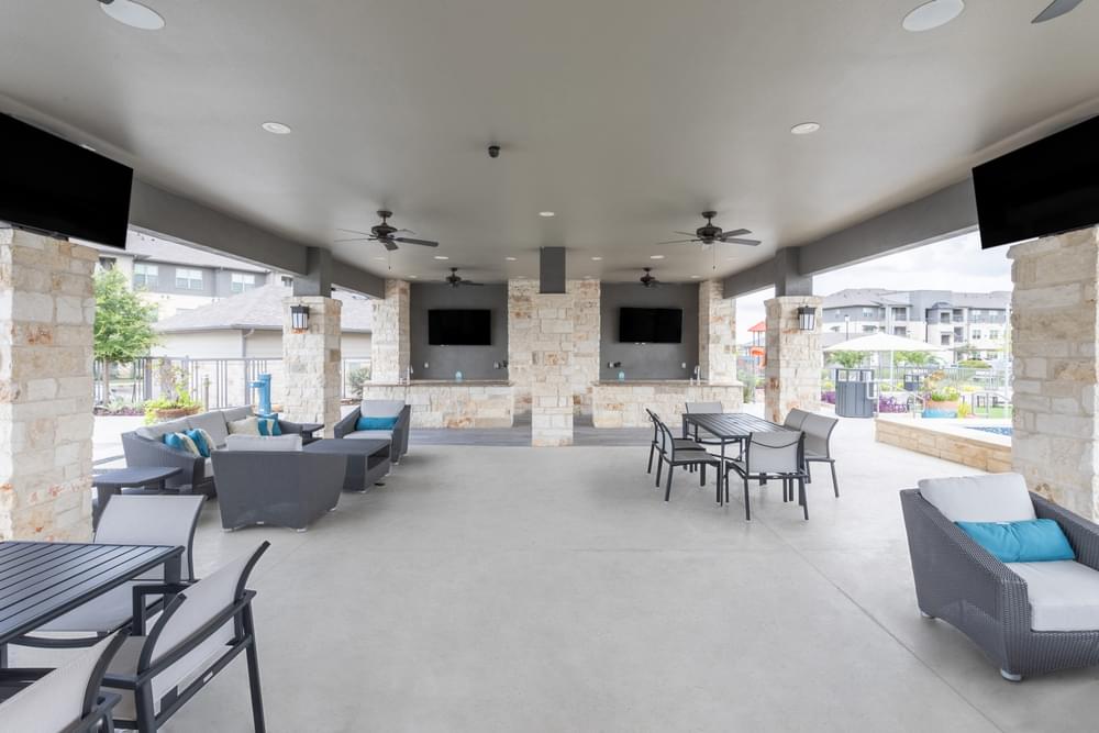 the clubhouse at the preserve at polk apartments with tables and chairs