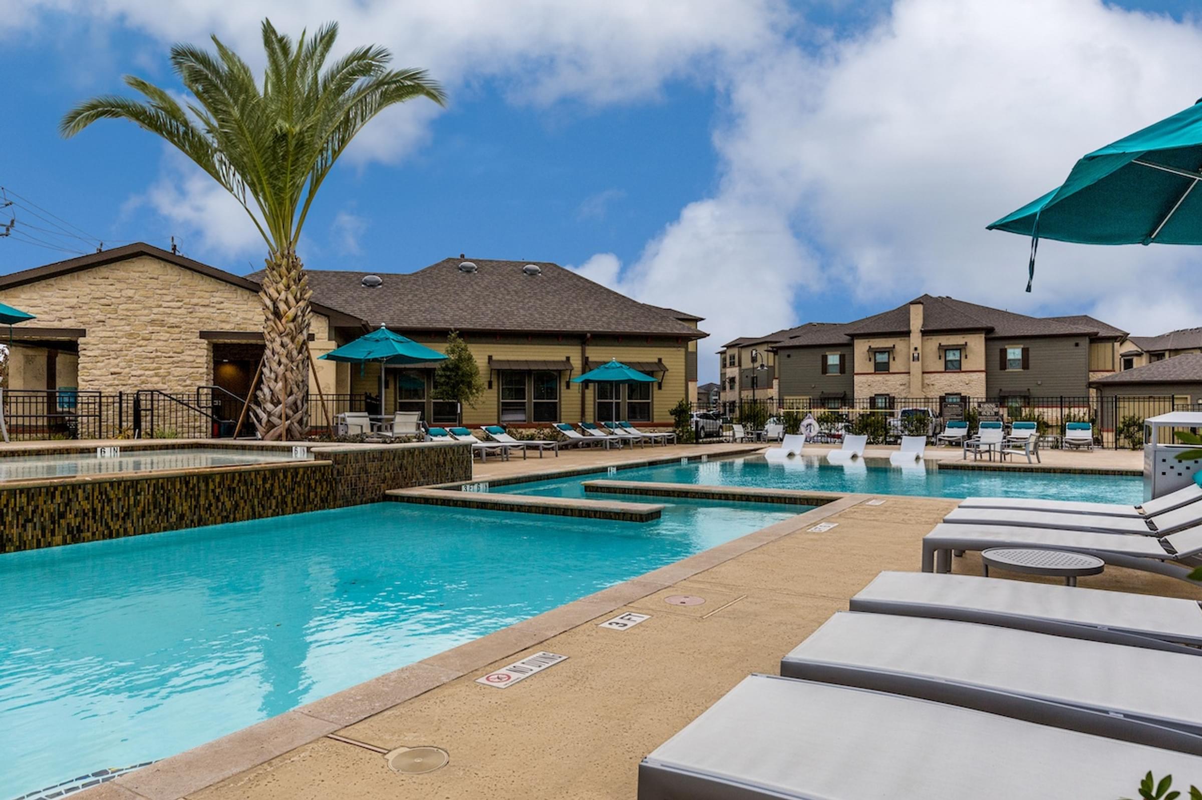our apartments have a large swimming pool with lounge chairs