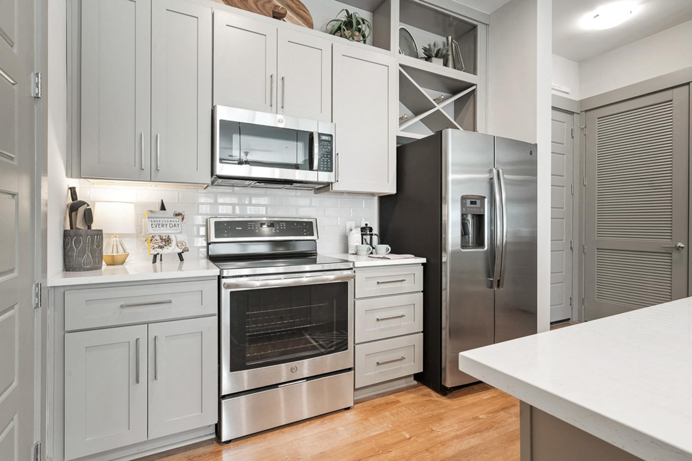 Quartz Countertops, Tile Backsplashes, French Door Refrigerators, and Smooth, Ceramic Cooktop Stoves