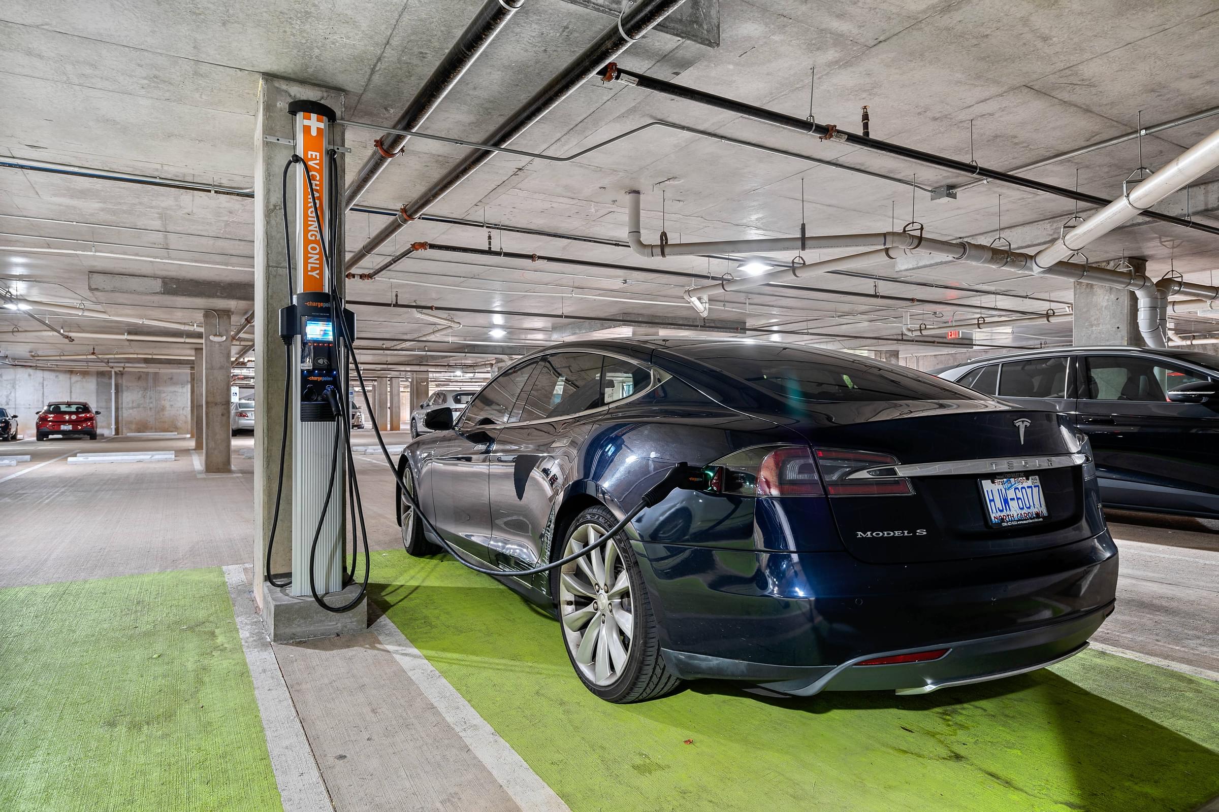 a car parked at a gas station in a parking garage