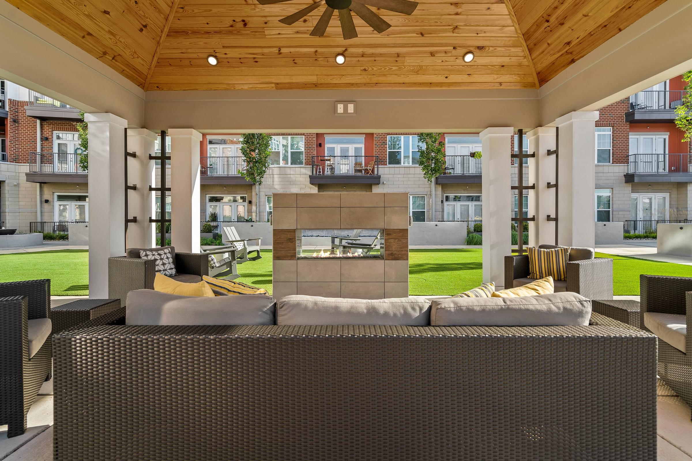 Gorgeous Outdoor Lounge Area with Plenty of Seating and a Fireplace