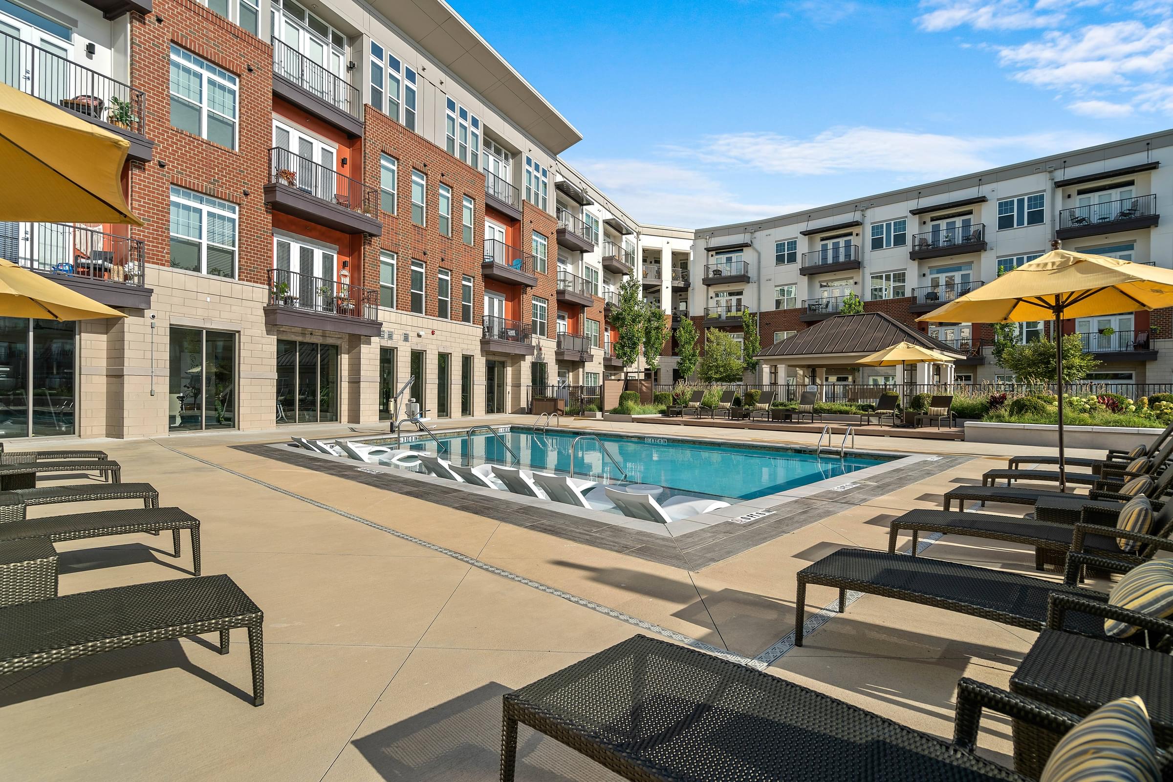Saltwater Swimming Pool with Aqua Ledge and Poolside Lounge Seating