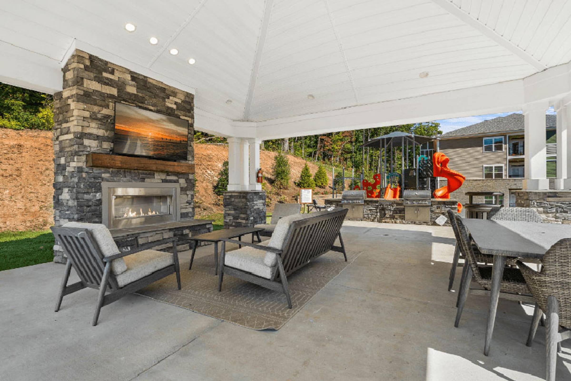 Covered Patio with Lounge Seating and a Fireplace