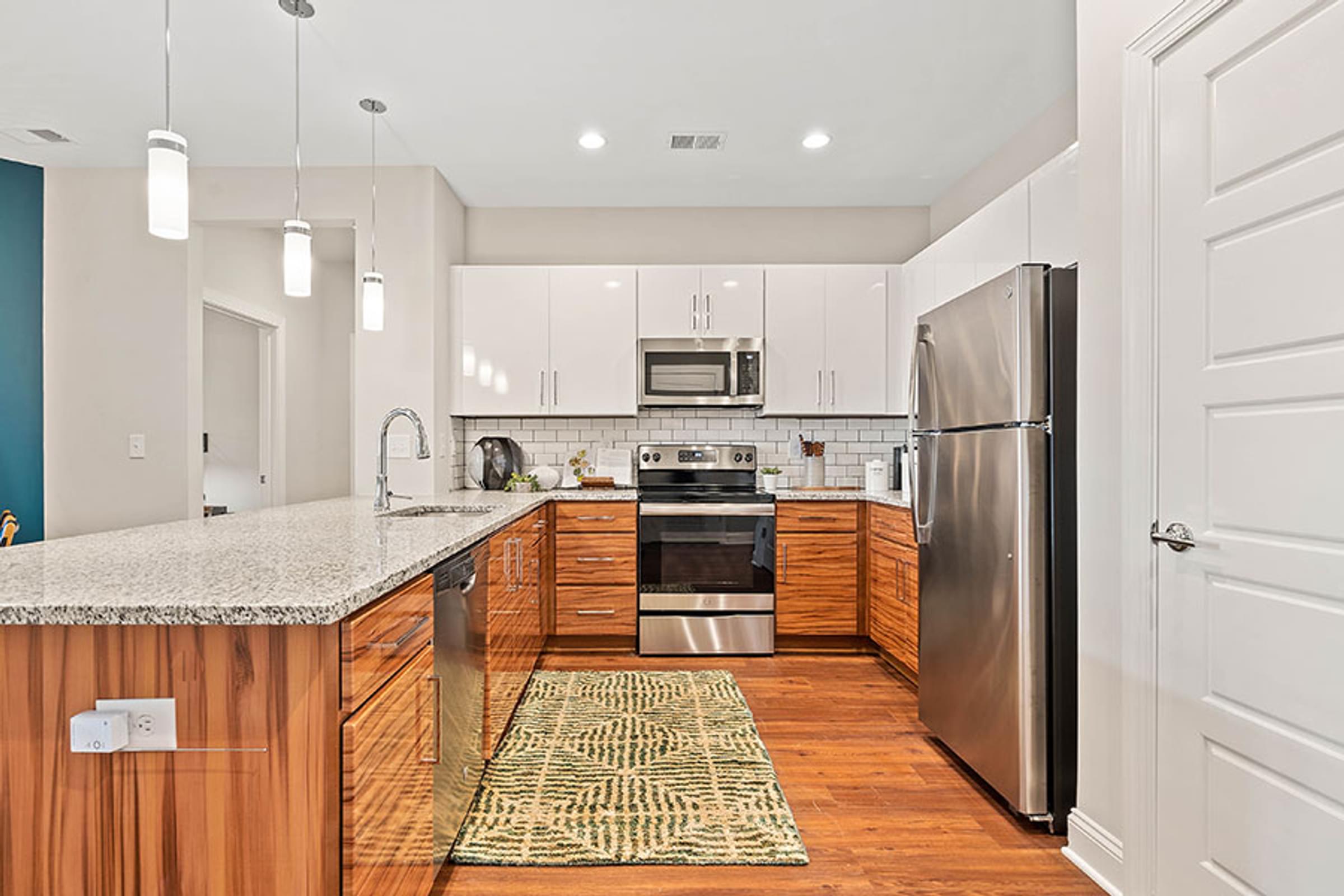a kitchen with stainless steel appliances and wooden cabinets