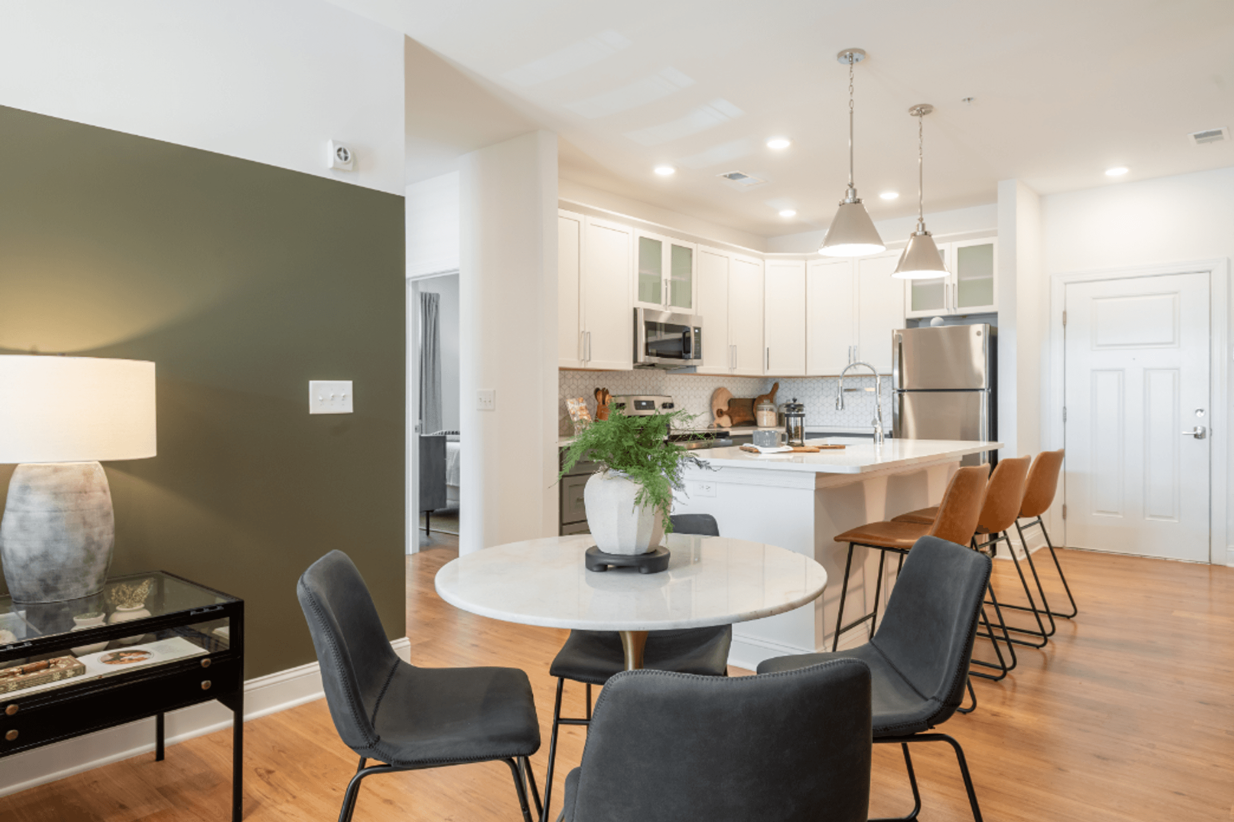 an open kitchen and dining room with a table and chairs