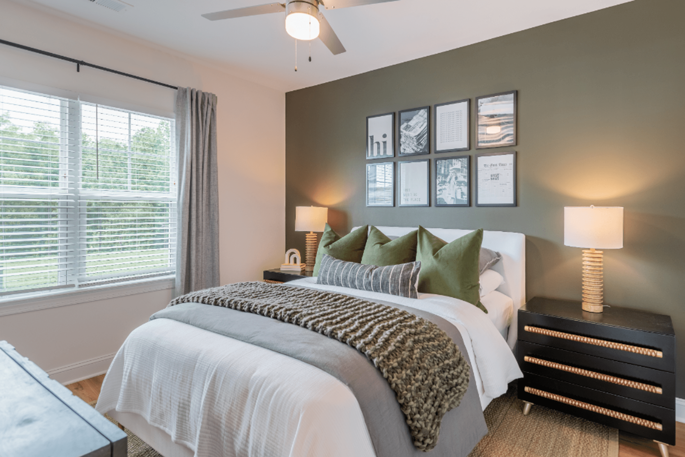 a bedroom with a large bed and a window