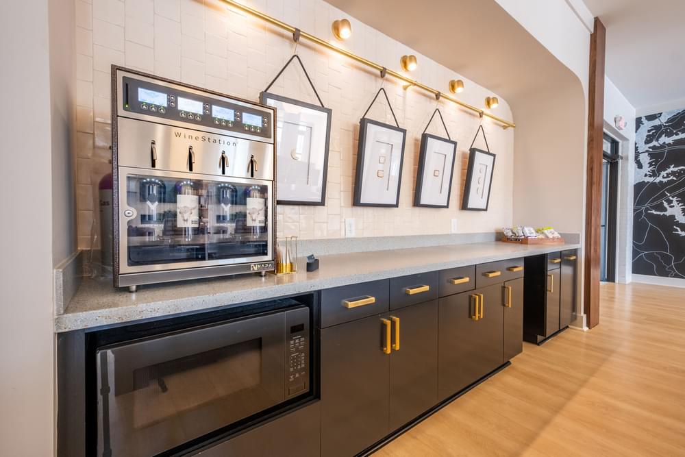 a kitchen with stainless steel appliances and a coffee machine
