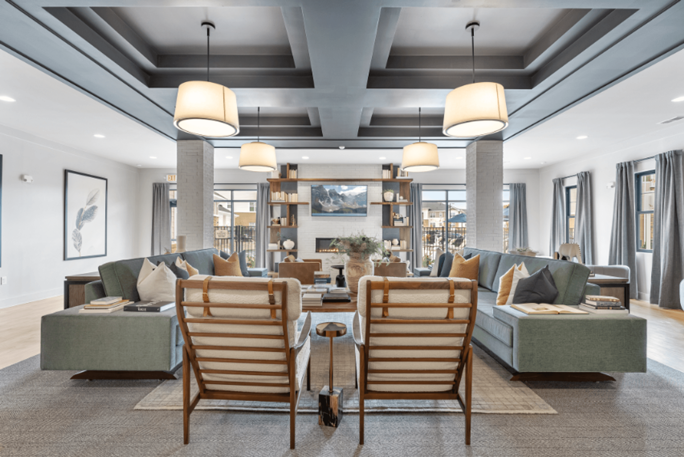 a living room with chairs and couches