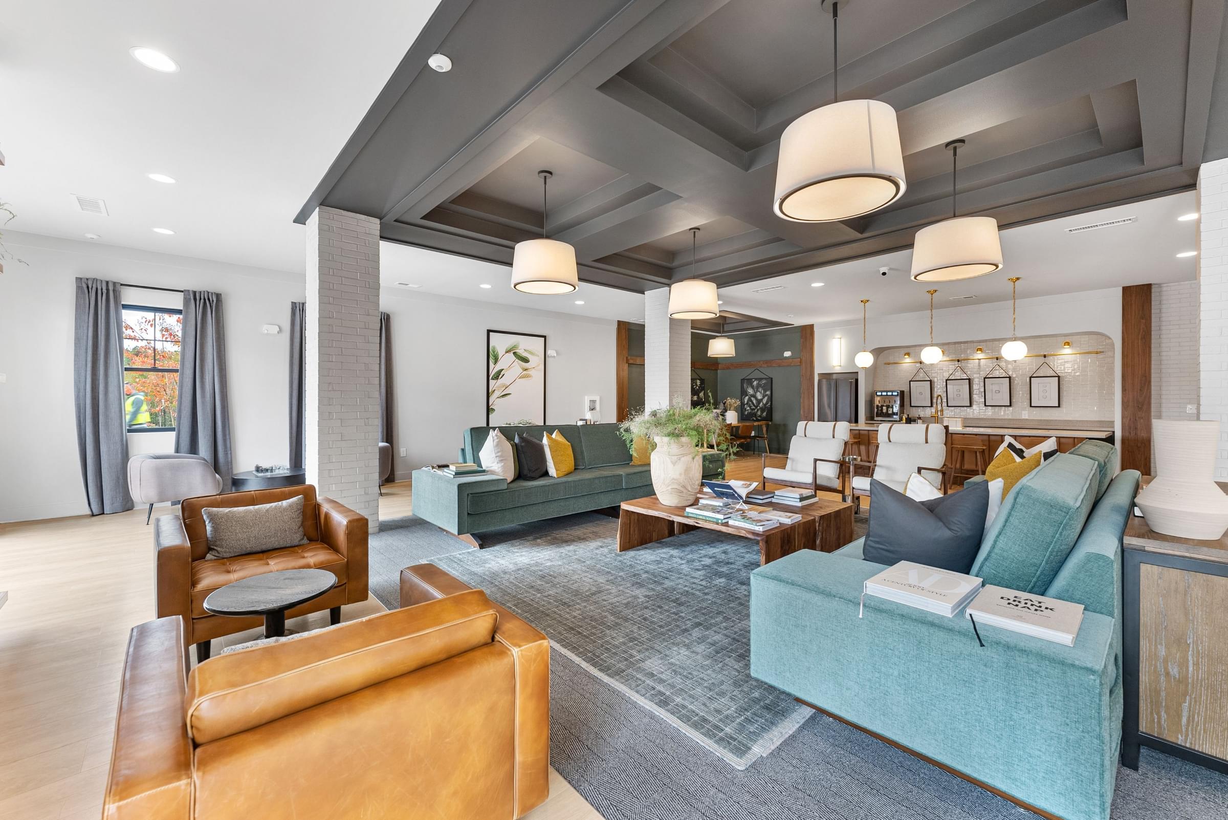 a living room with couches and chairs and a table