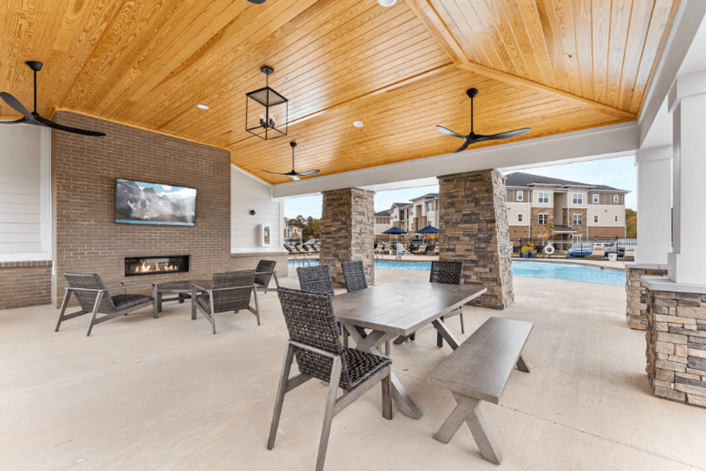 the retreat at thousand oaks clubhouse patio with pool table and fire place
