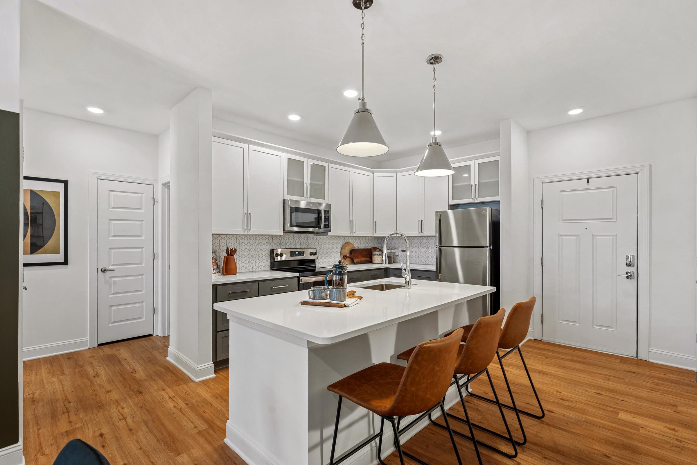 Modern Kitchens with Stand-Alone Islands, Quartz or Granite Countertops, and Designer Tile Backsplash