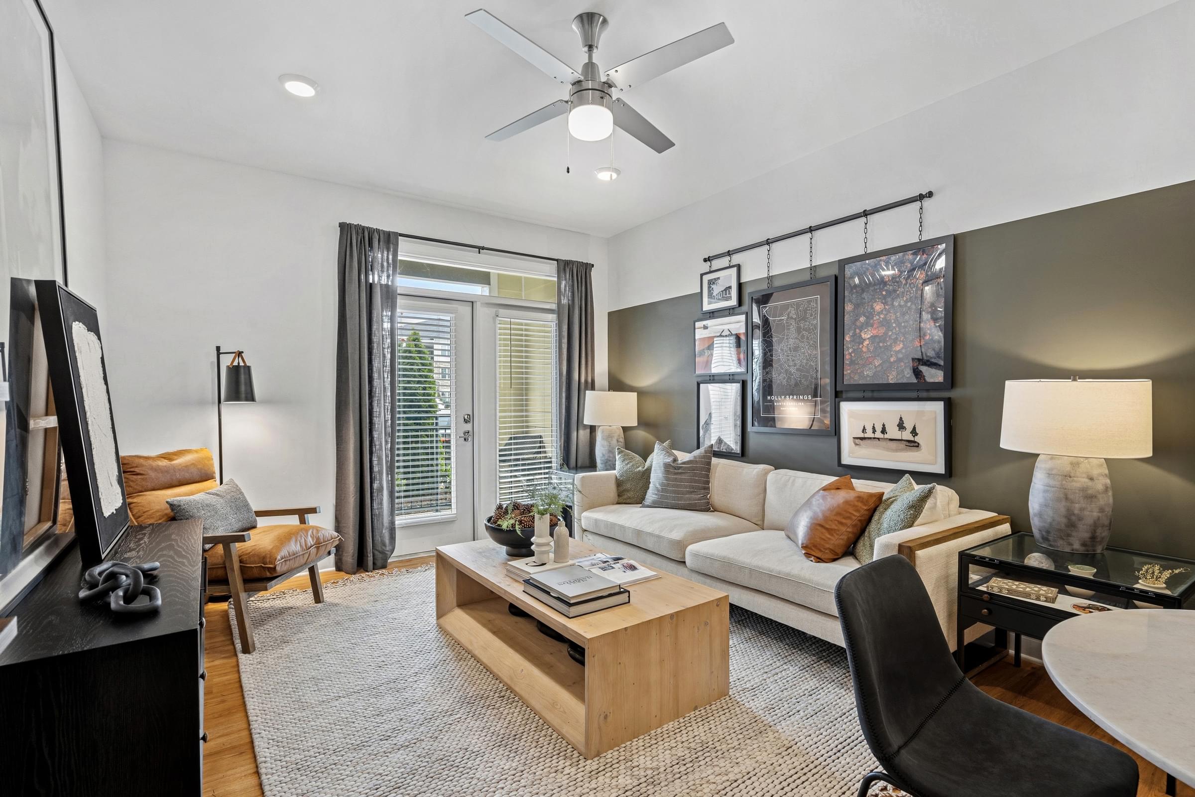 A modern living room with a wooden coffee table and a grey rug.