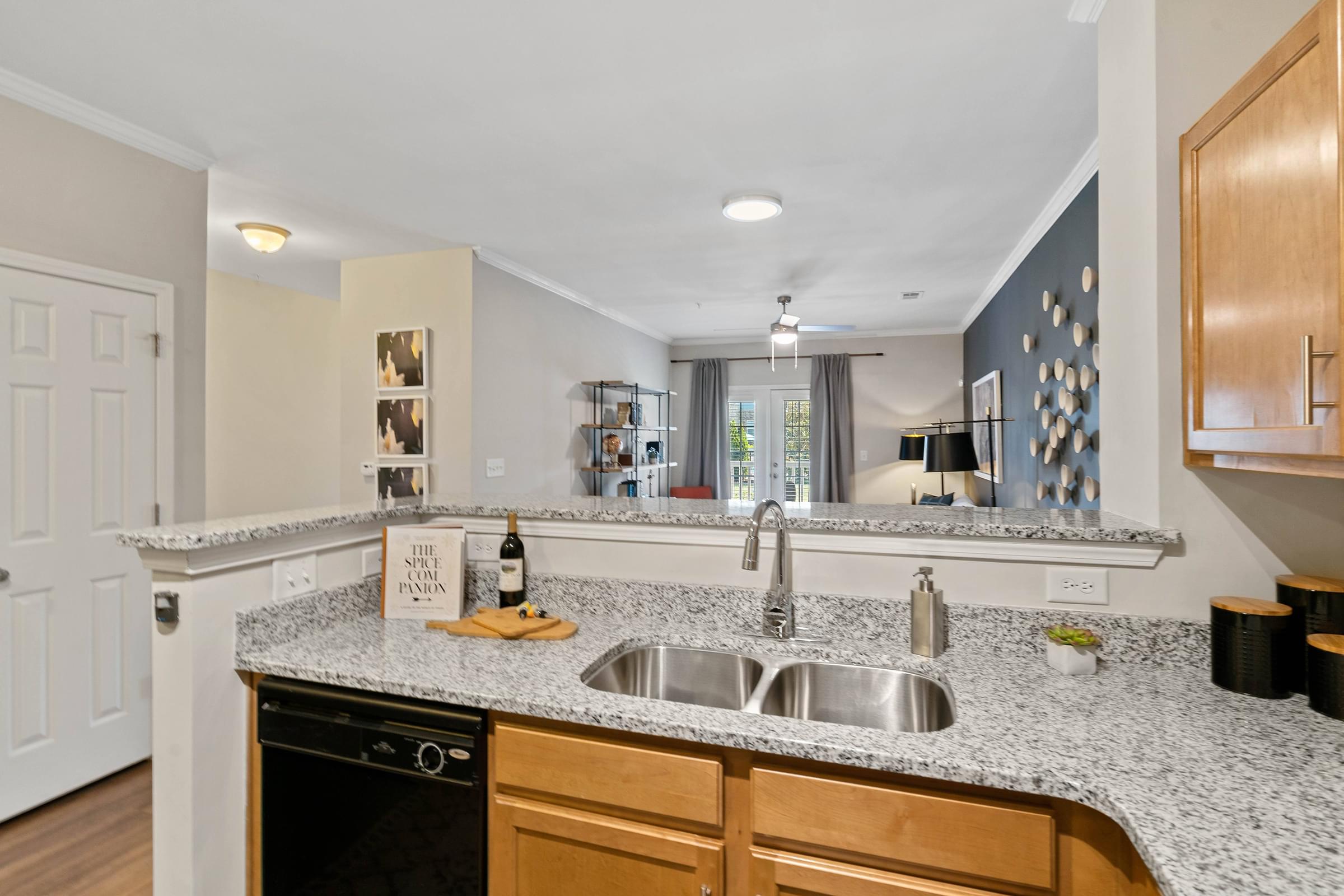 a kitchen with granite counter tops and a sink