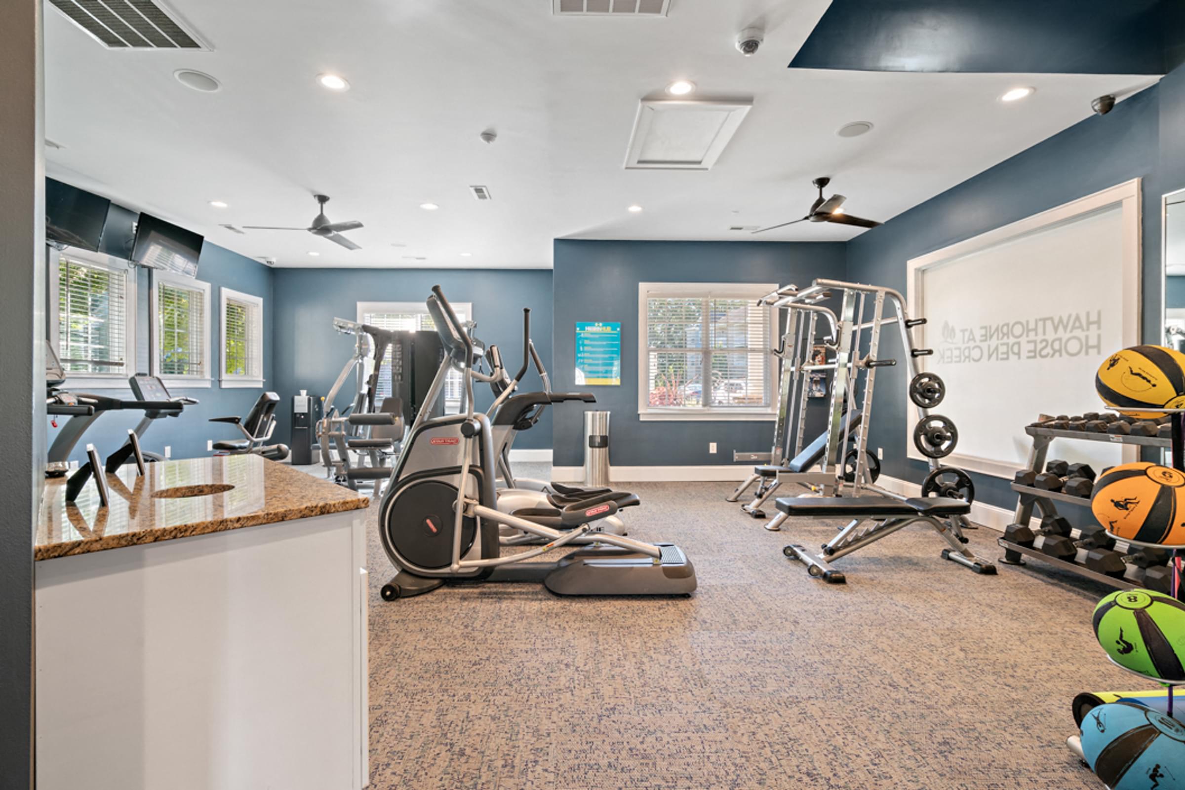 24-hour Fitness Center Equipped with Cardio and Free Weights