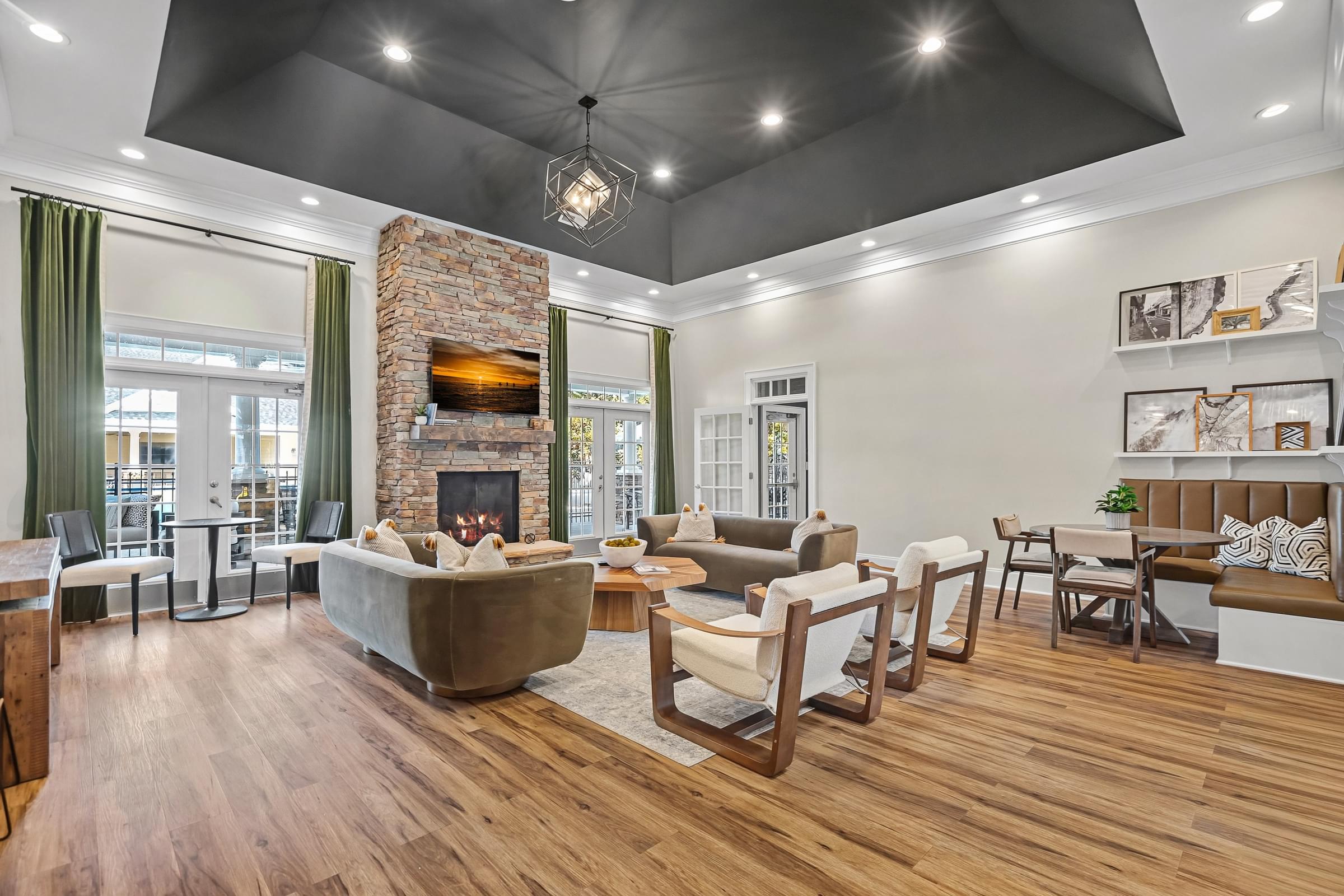 A modern living room with a fireplace and a large couch.